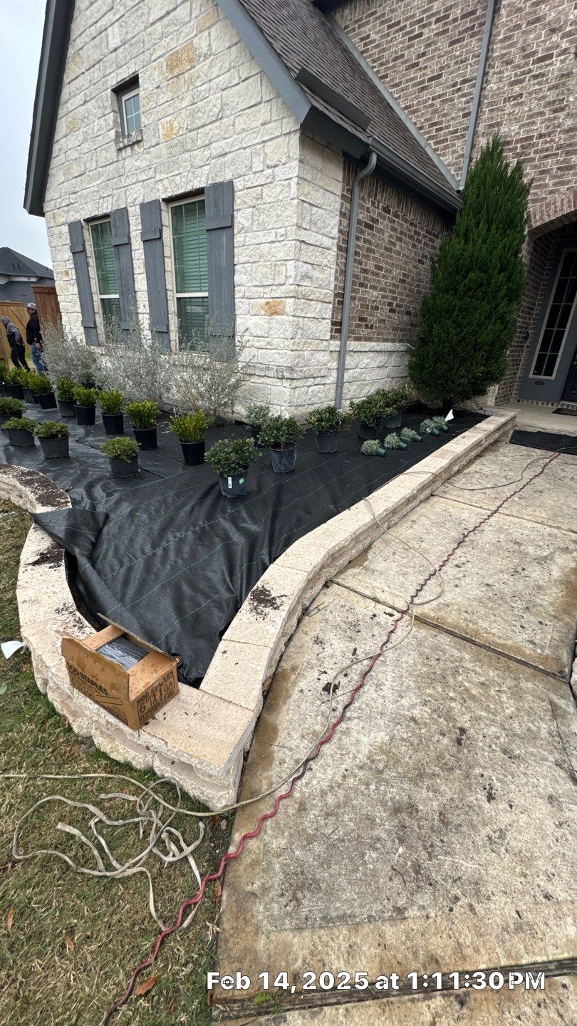 🌿✨ Darlene & Andrew’s Amazing Curb Appeal Transformation  Some projects are more than just landscaping—they’re a conversion of curb appeal from the ground up. For Darlene & Andrew, Alejandro and the Texas Urban Team designed and delivered a complete solution that reshaped their flower beds, solved drainage challenges, and gave new life to the sideyard.  💡 From planning to execution, every step was tailored to build both beauty and functionality:  🌸 Flower Beds, Reinvented  Demolition of old beds, plants, and mulch.  Fresh soil preparation, weed protection, and a brand-new retainer wall built with hand-cut stone and decorative caps.  Carefully selected plants and garden mix to ensure health and visual harmony.  💧 Drainage & Irrigation Upgrades  Outdated corrugated pipes replaced with PVC drainage lines to carry water safely away from the foundation.  New irrigation system combining drip lines and sprinklers—watering plants while keeping the house walls protected.  Sideyard drainage extended with catch basins and PVC piping to prevent water pooling and foundation stress.  🚶 Functional Sideyard with Walkway & Trash Area  Graded and leveled sideyard to manage runoff.  Installed a modern gravel and paver walkway for easy access.  Built a firm and tidy concrete-paver pad for trash containers—making the space both practical and polished.  🛠️ Stonework & Craftsmanship  Every stone in the retainer wall was cut, set, and secured by the team of handcrafters, ensuring a durable build that doubles as a design statement.  ✅ Outcome: Darlene & Andrew’s property now has better drainage, a clean and organized sideyard, and elegant new flower beds—all designed for long-term durability and lasting beauty.  📢 Before hiring anyone, review our portfolio. Our work speaks louder than words—each project is a blend of function, protection, and design crafted to last. by Texas Urban Elements