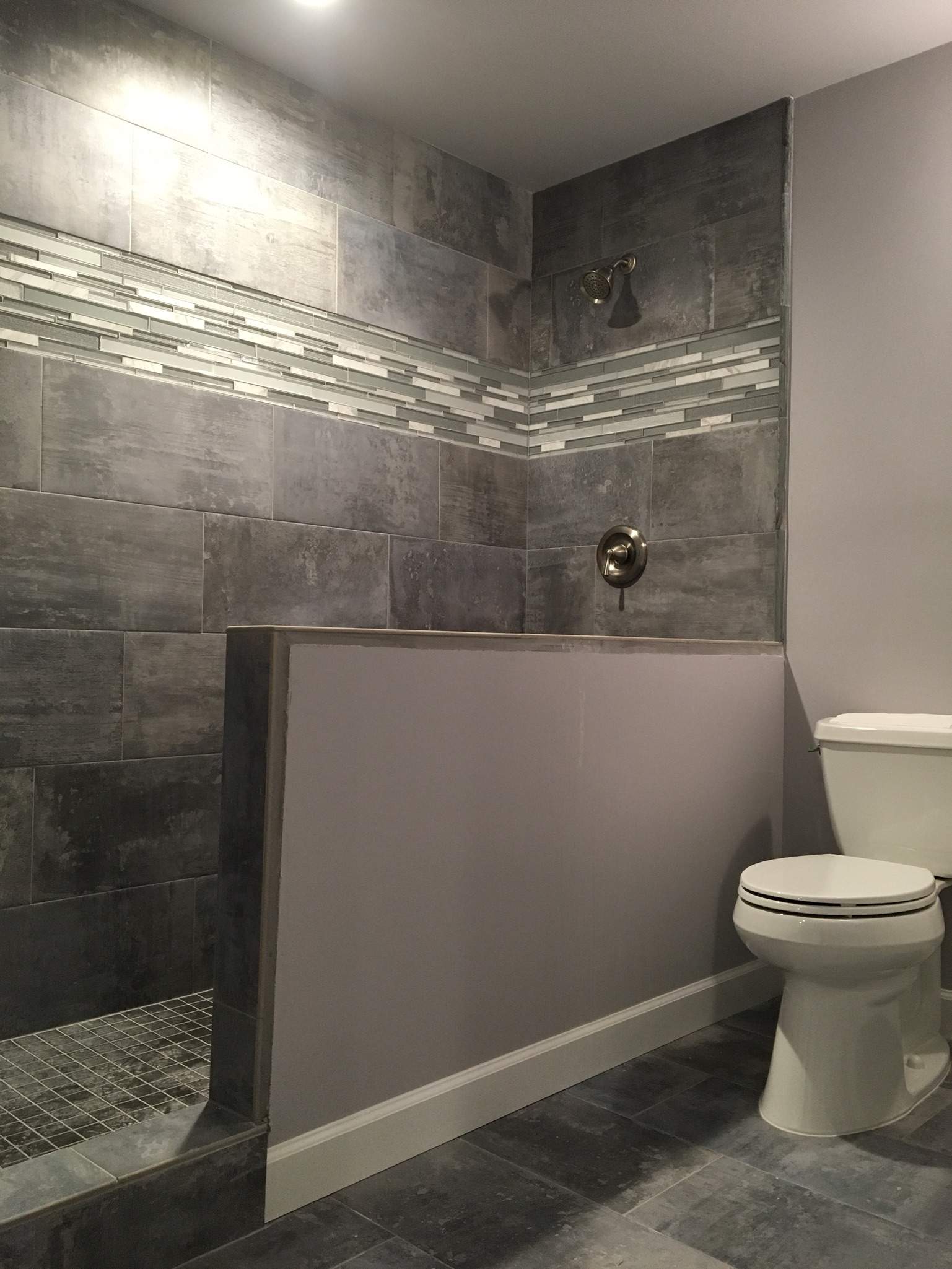 Finished Basement with Custom Media Room and Bathroom in Duluth by Swift Home Renovations