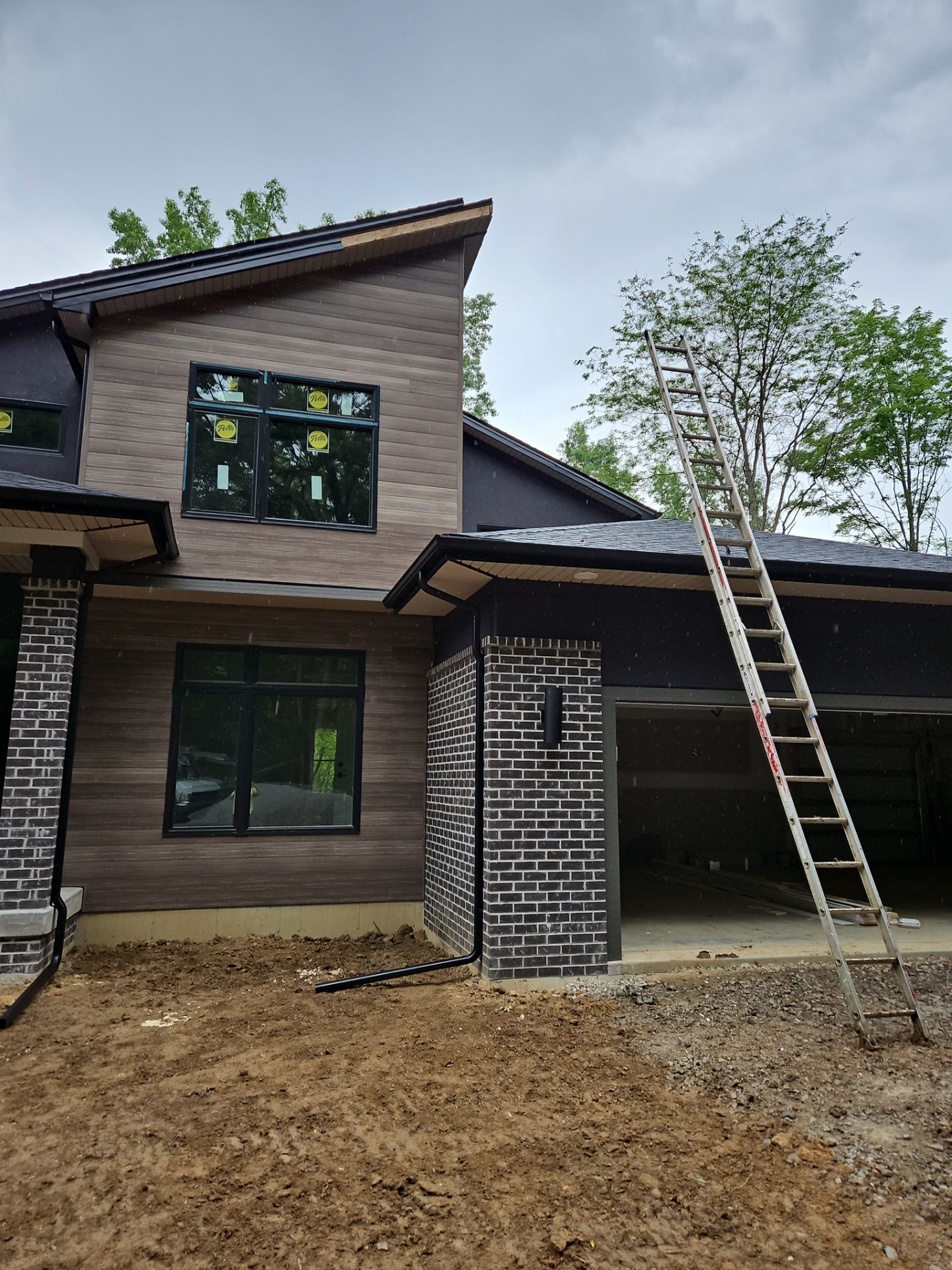 Gutter Installation using 5" Seamless Gutters and Downspouts by RoofX 
