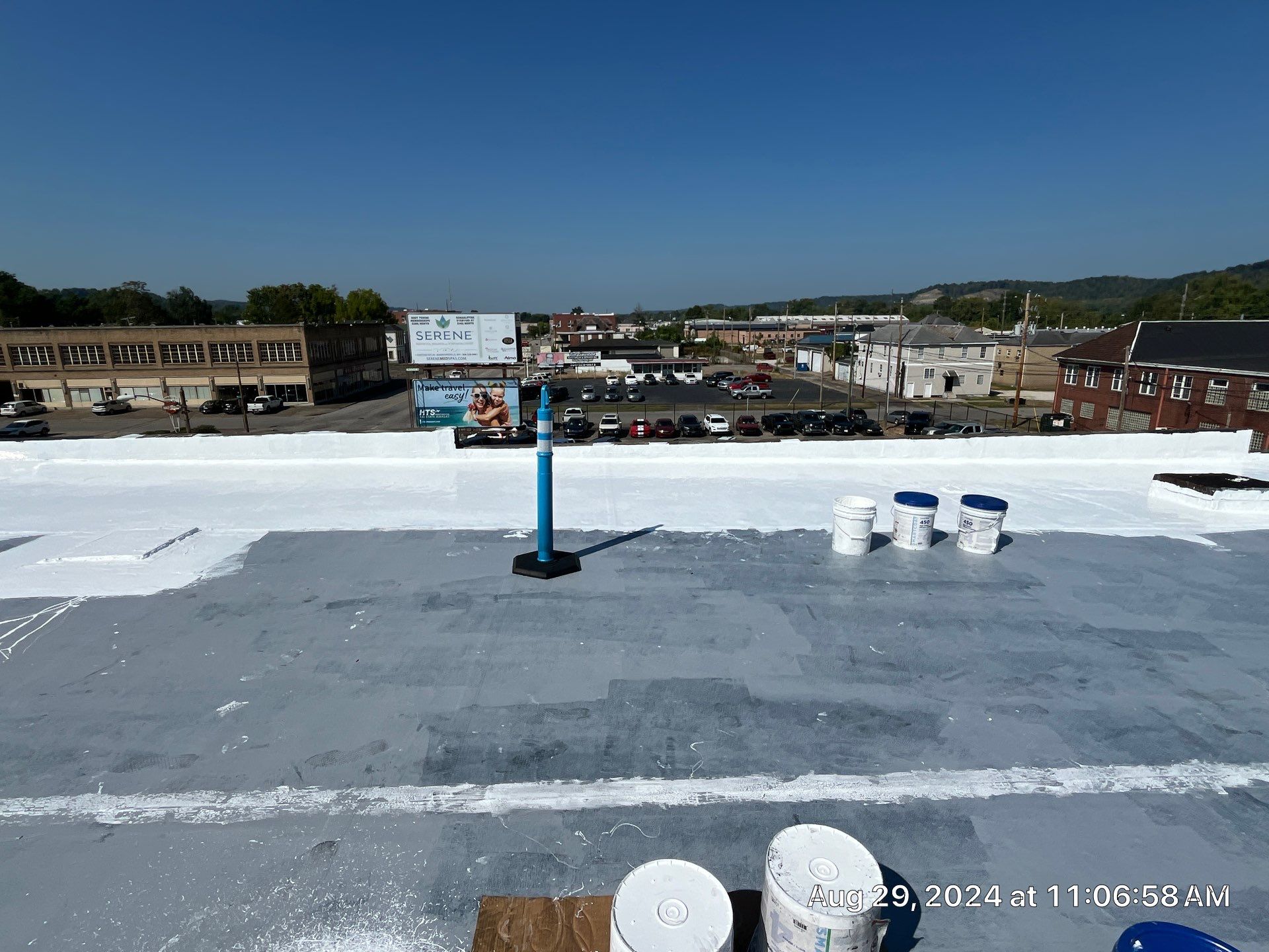 Commercial Roofing Installation using smartcoat Roof coating by Fahey Roofing + Contracting