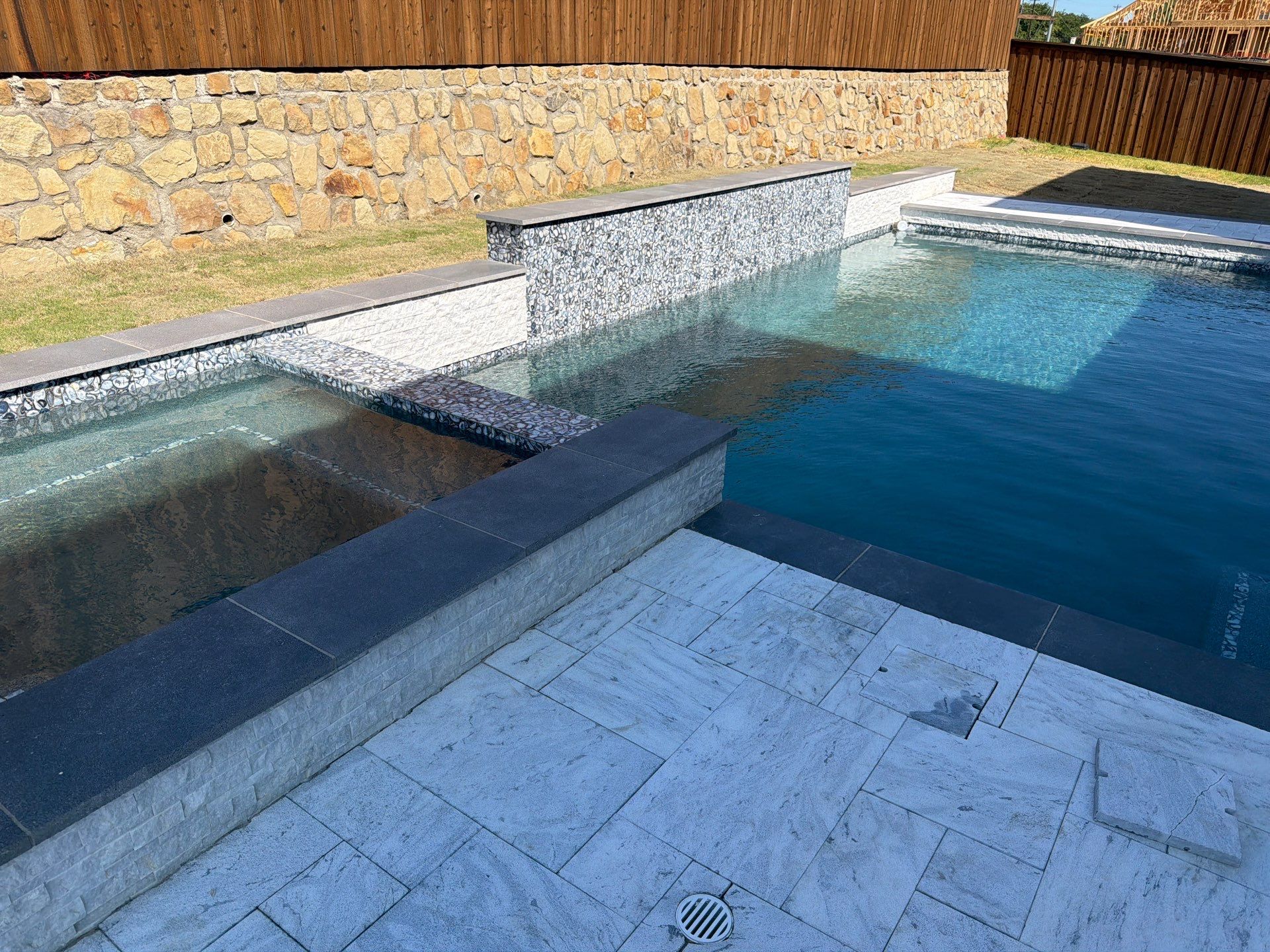 Modern Geometric Pool with Raised Spa and Marble Deck by Pinnacle Pools and Spas - DFW