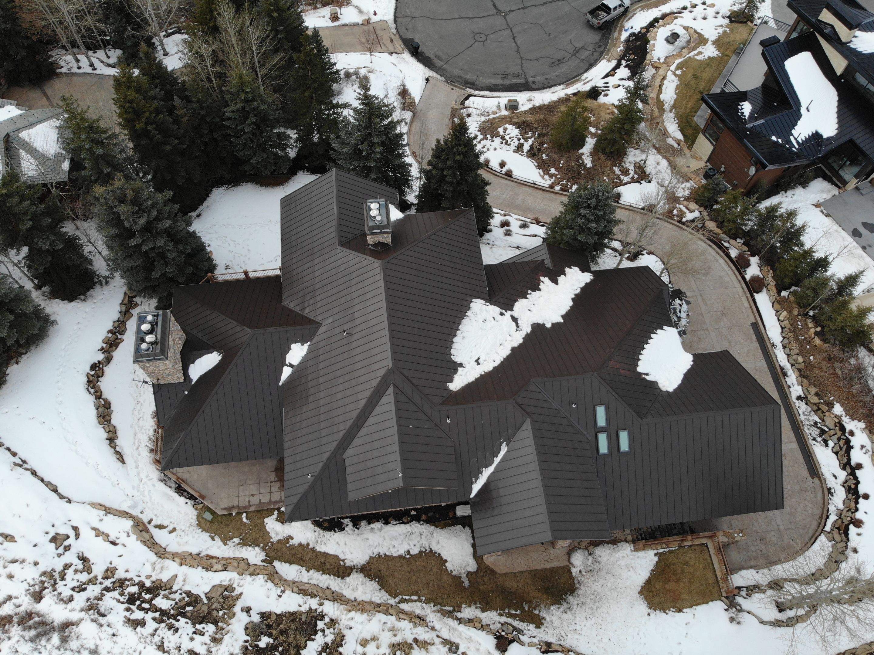 Standing Seam Metal Roof Replacement After Snow Damage by ASAP Roofing & Restoration