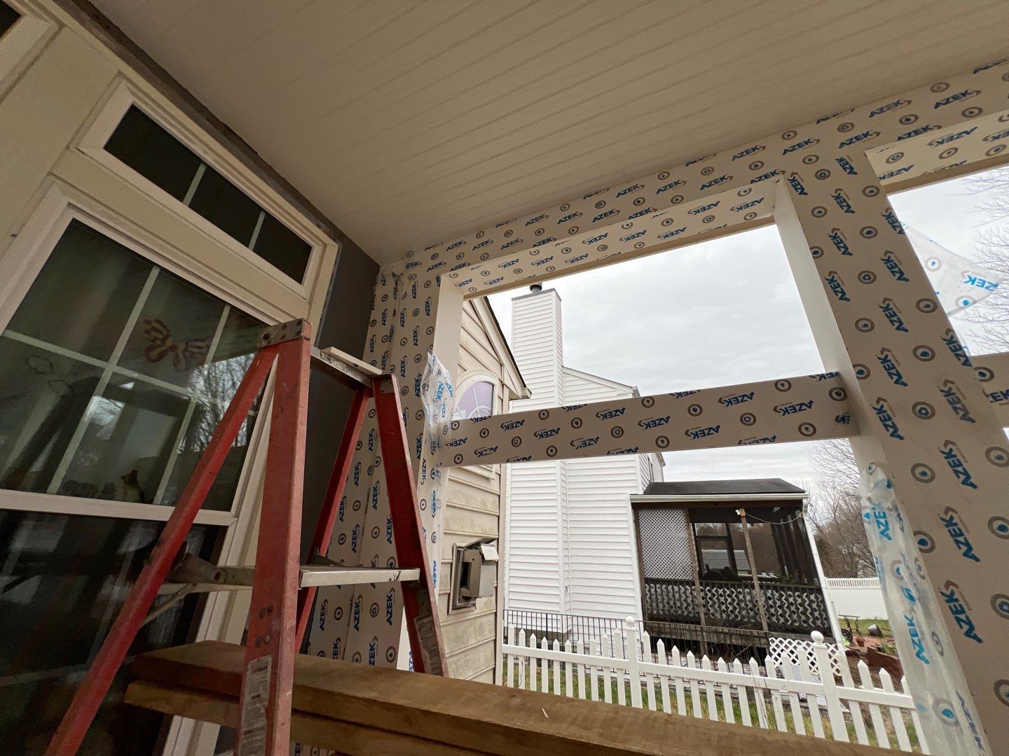 Custom Screened-In Porch with Stamped Concrete Patio in Warrenton by Jakari Restoration & Construction LLC