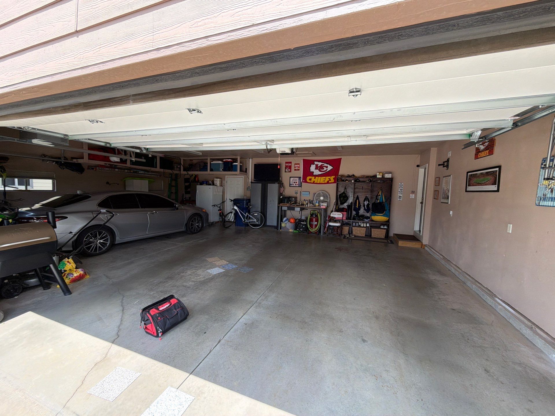 Multi-Car Garage Floor Coating and Crack Repair in Tea by Select Painting, Coatings & Garage Cabinets