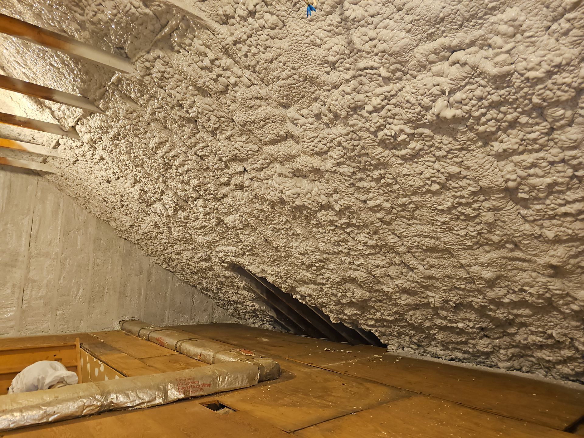 Attic Retrofit using open cell spray foam by NYS Foam & Energy