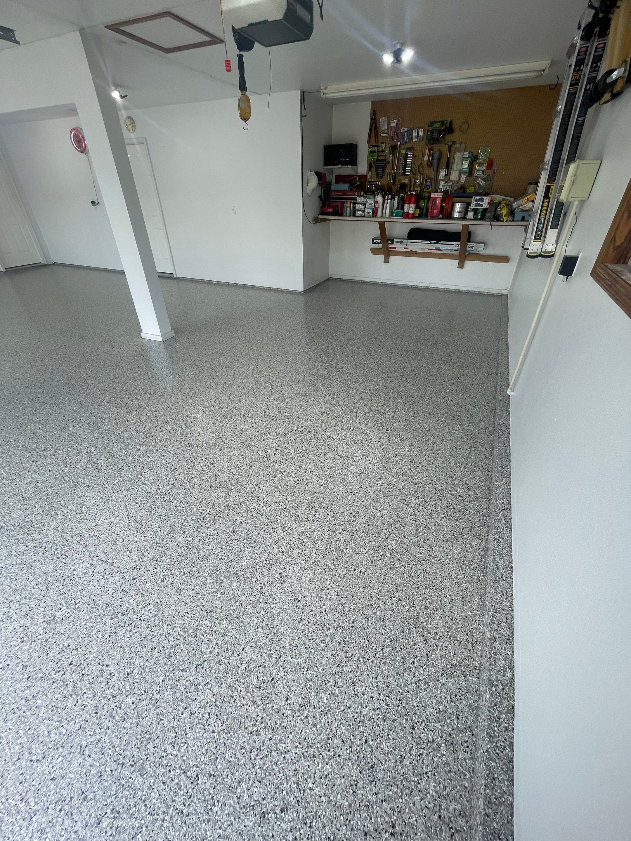 Multi-Car Garage Concrete Coating with Coyote Flake Finish in Sioux Falls by Select Painting, Coatings & Garage Cabinets