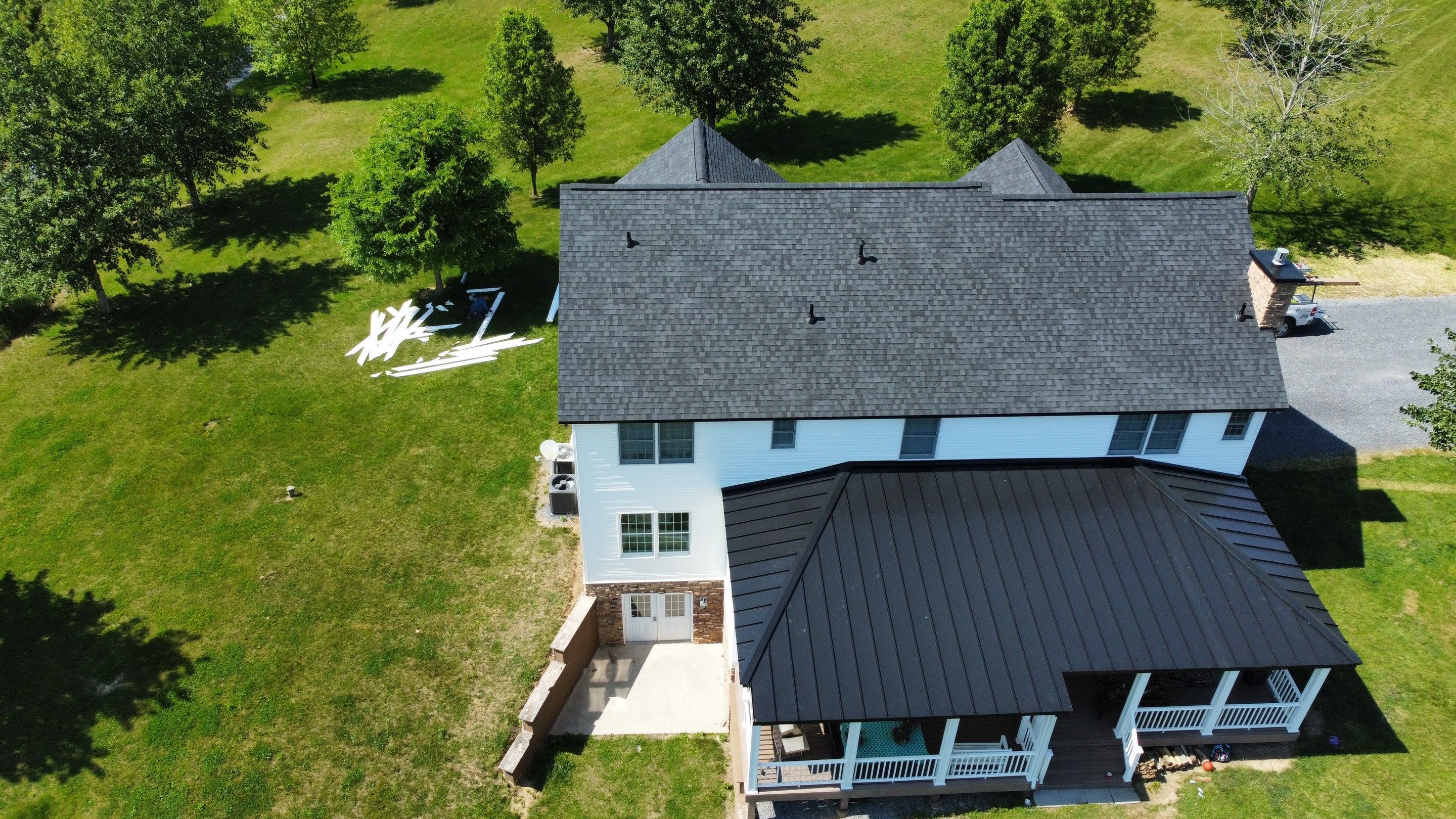 Roof Damage using Certainteed Lifetime Roofing System- Moire Black Landmark Pro shingkes with shadow ridge caps. by BulletpROOF Exteriors