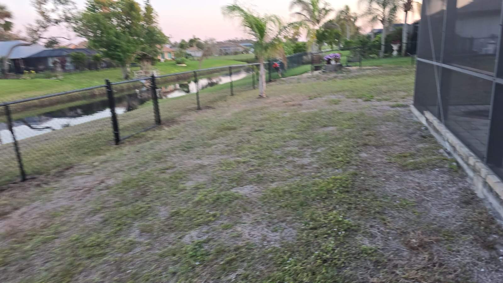 Waterfront Black Chain Link Fence Installation in Rotonda West by True Fence LLC