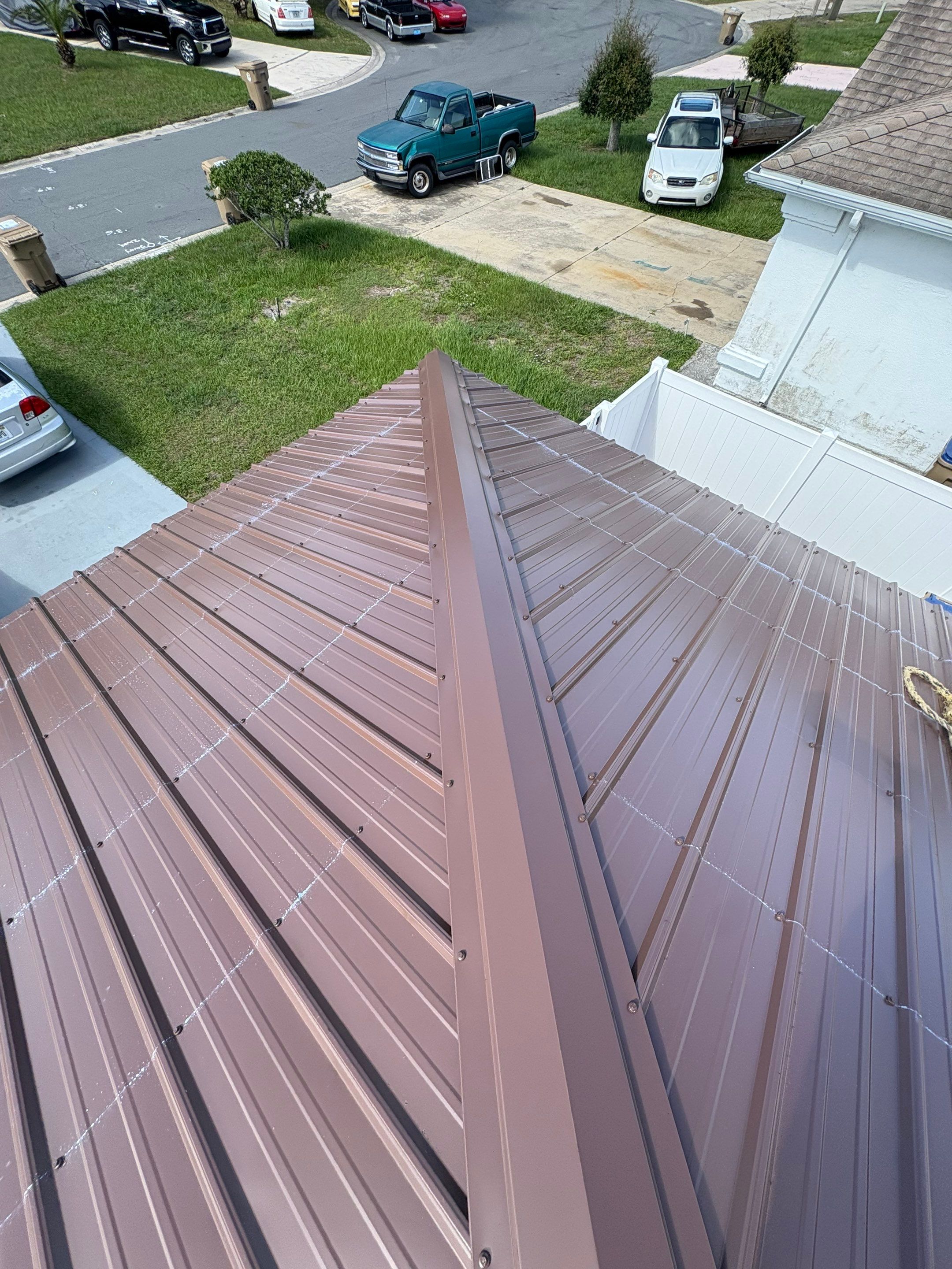 Residential Metal Roofing Installation and Gutter Replacement in Kissimmee by Pinnacle Roofing Group