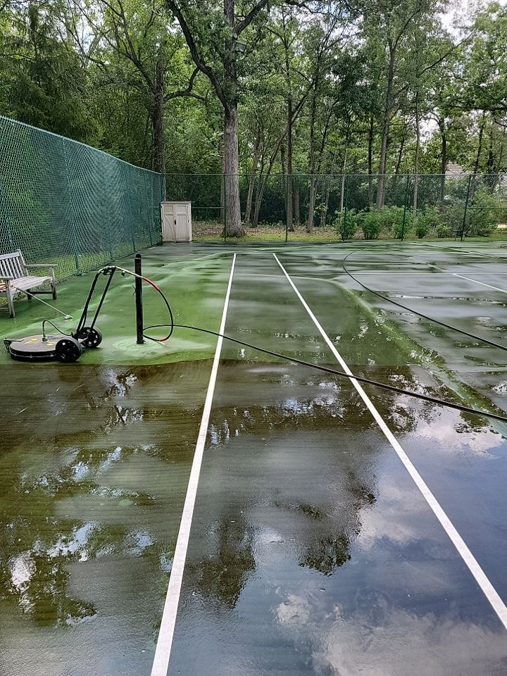 Tennis court cleaning by Northern Power Washing LLC.