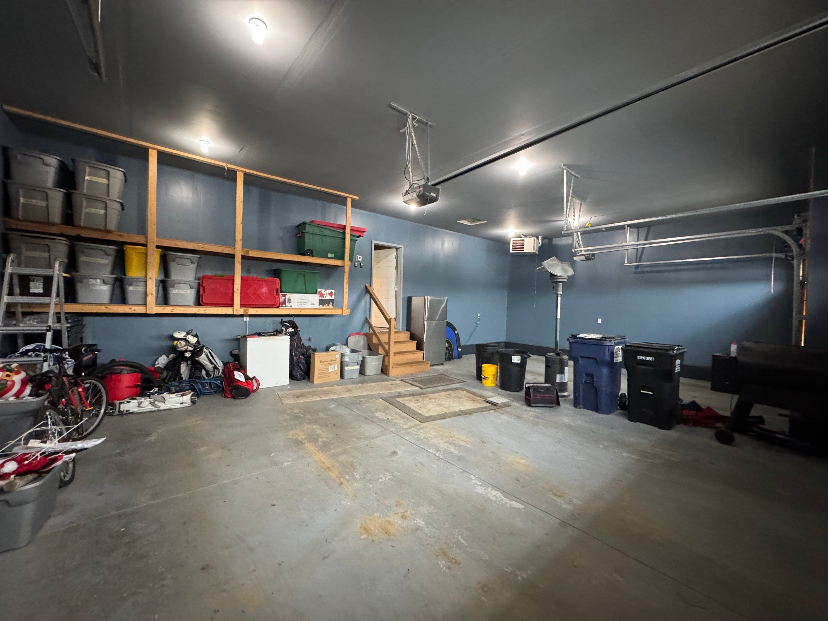 Grey Speckled Epoxy Garage Floor and Stair Coating in Sioux Falls by Select Painting, Coatings & Garage Cabinets