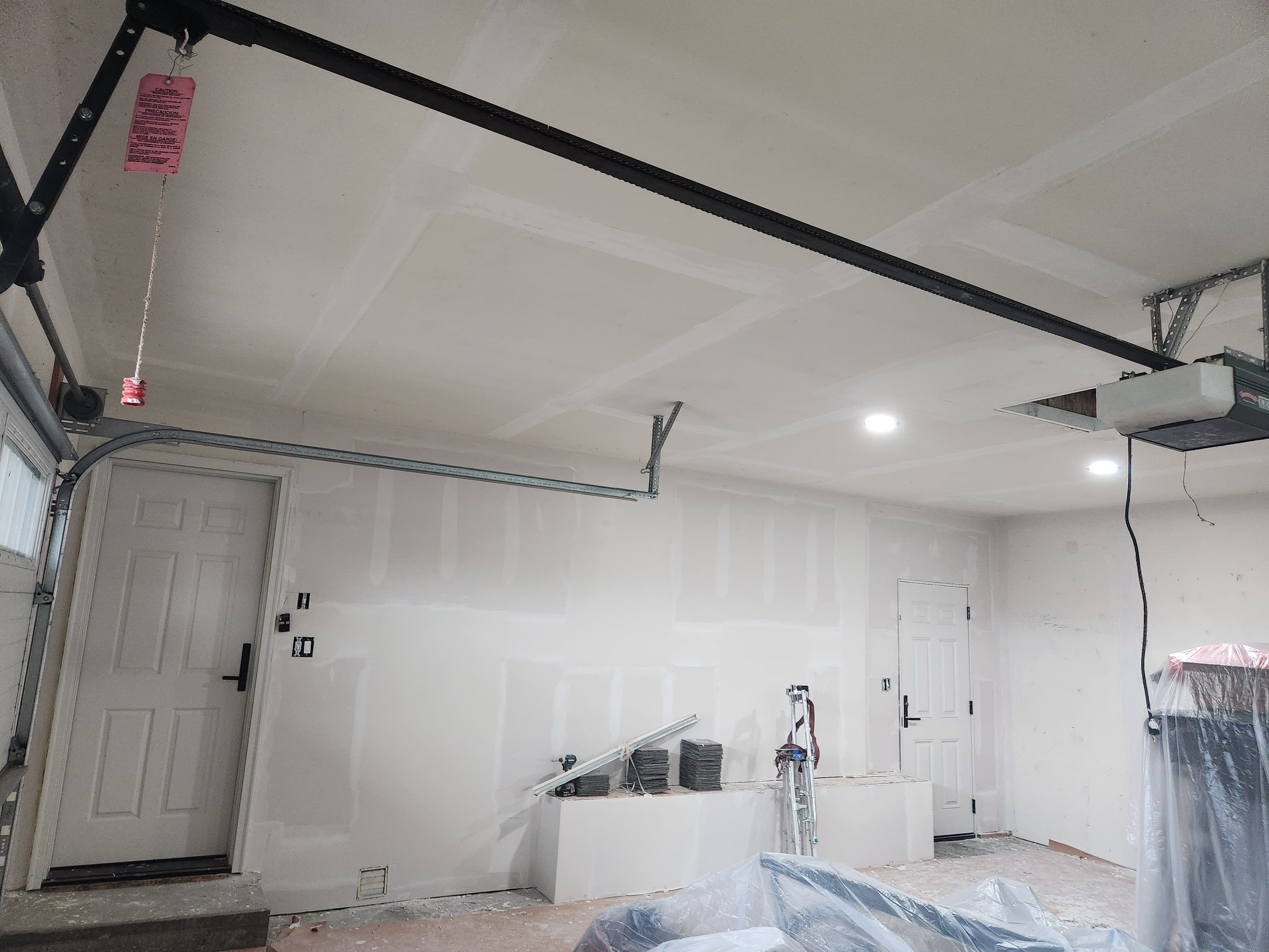 Yankton Garage Remodel with Andersen Window Installation and Drywall by Select Painting, Coatings & Garage Cabinets