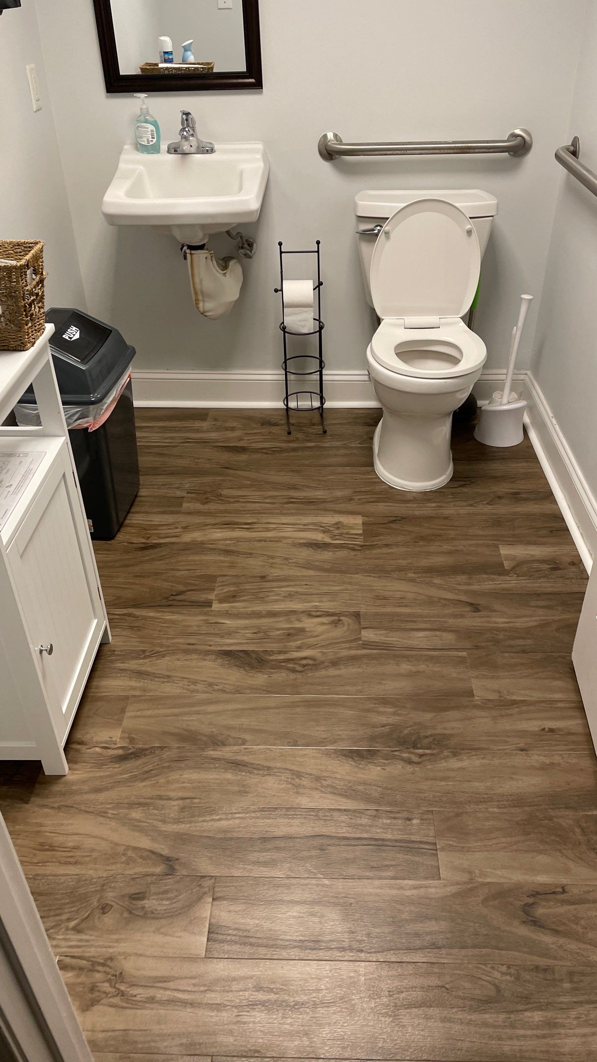 Office Remodel from Worn Out Carpet to Sleek Glued Down LVP by Footprints Floors of Coastal Carolina