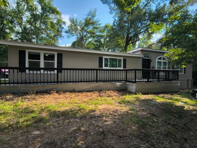 Exterior Painting in Tyler, TX | Black Back Porch, Wood & Shutters