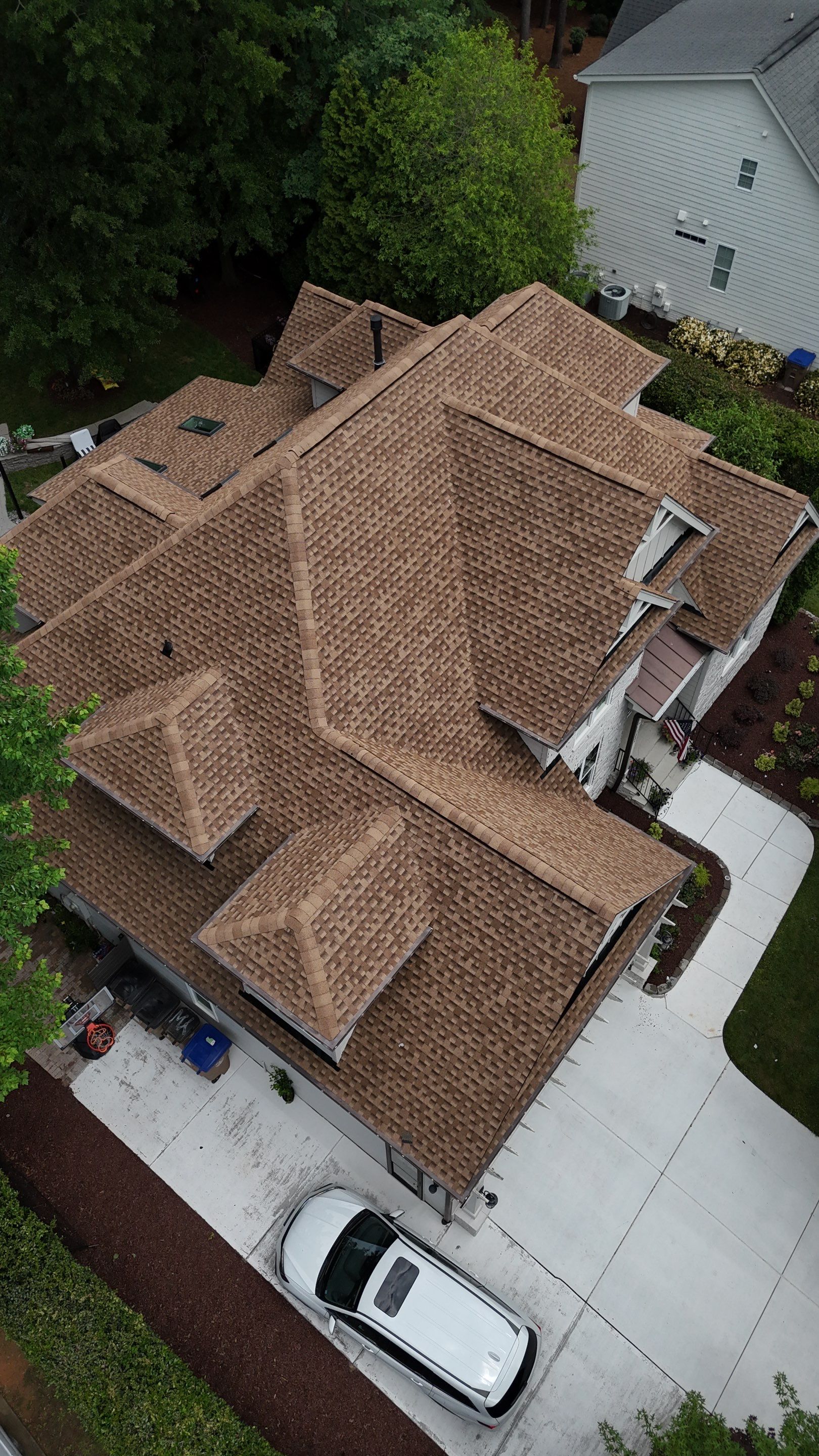 Roof Replacement - GAF Timberline HDZ Shakewood - 6” coppertone seamless gutters by Pro Performance Roofing