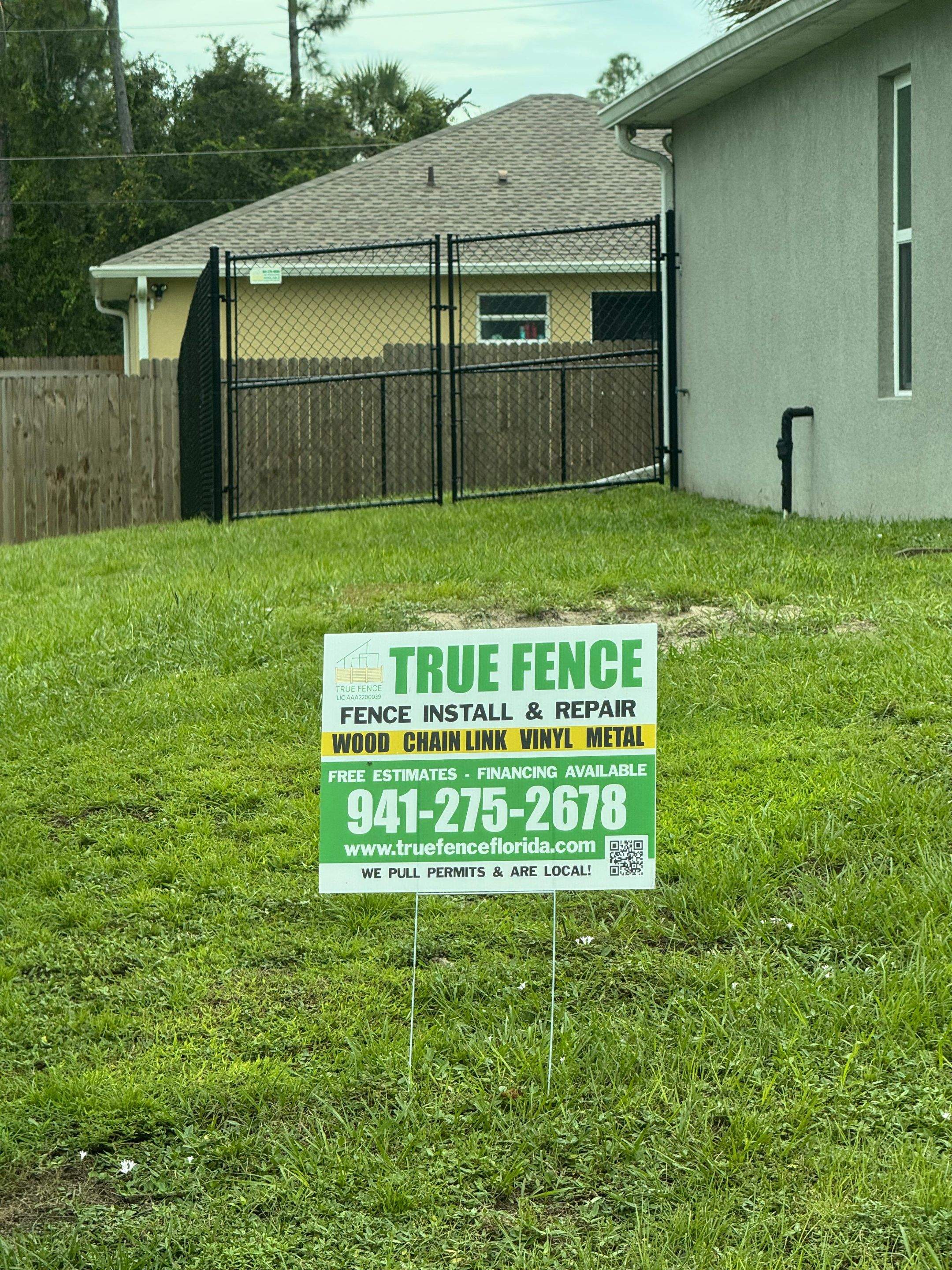 Black Chain Link Boundary Fence with Access Gates in North Port by True Fence LLC