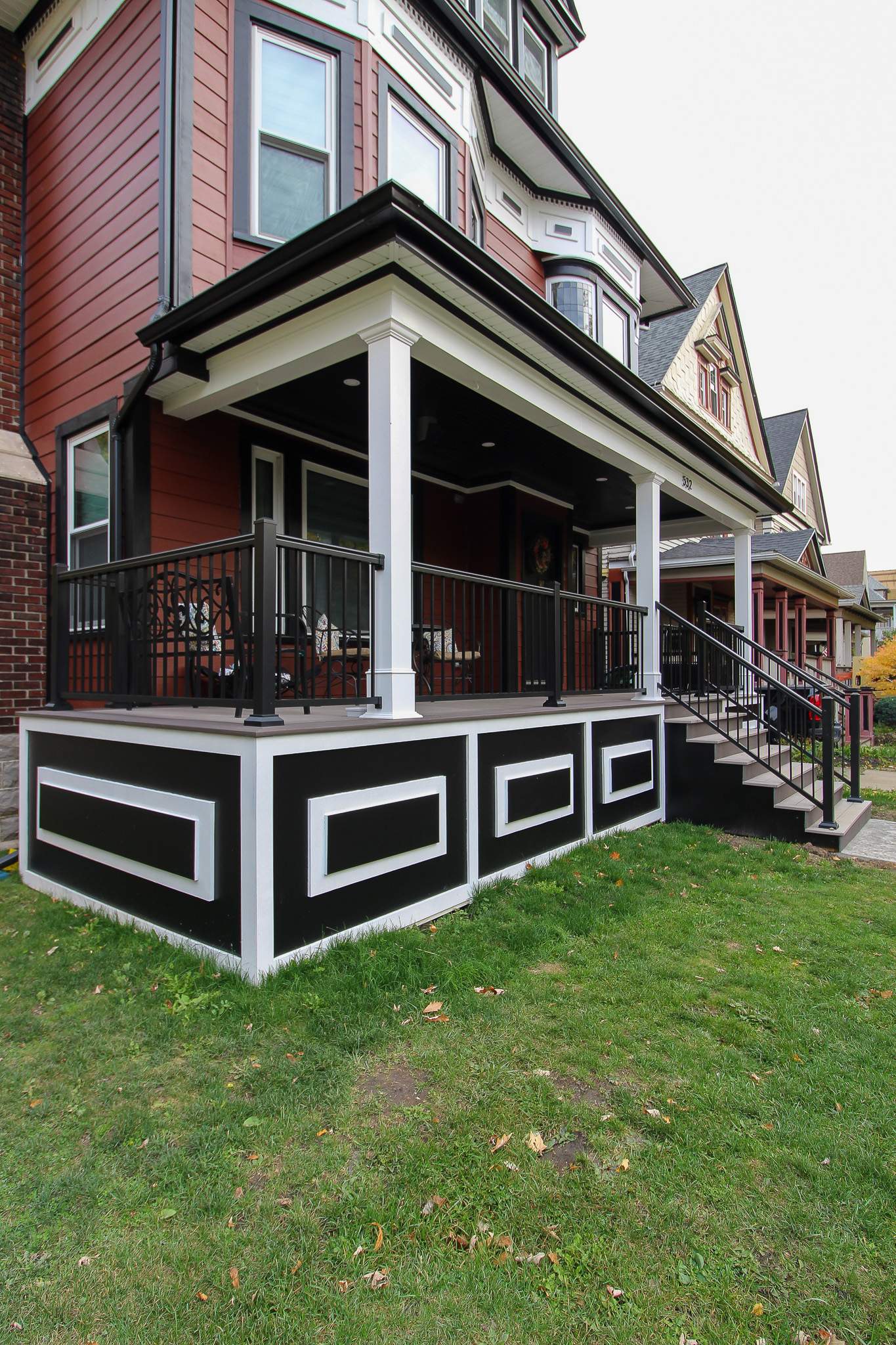 Exterior Renovations- Siding, Stamped Concrete, Porch, and Railings by Ivy Lea Construction