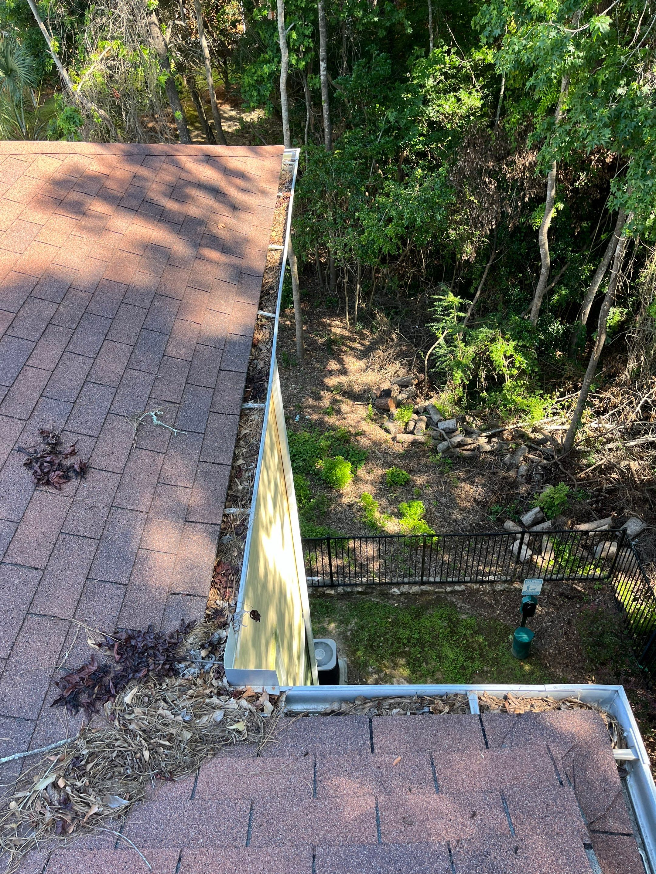 Commercial gutter cleaning Tallahassee, FL before photo with filled gutters
