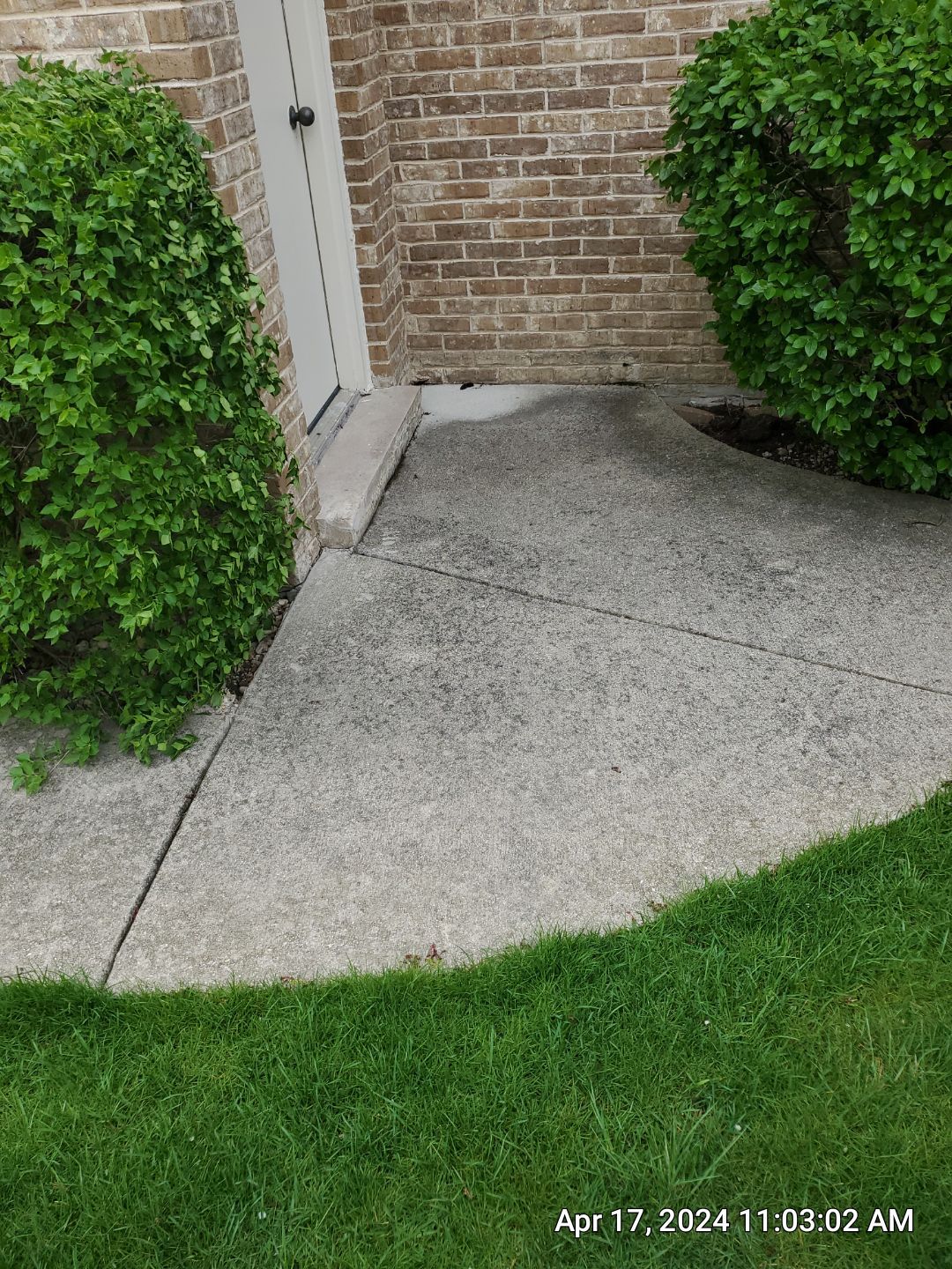 concrete patio and driveway cleaning by Northern Power Washing LLC.
