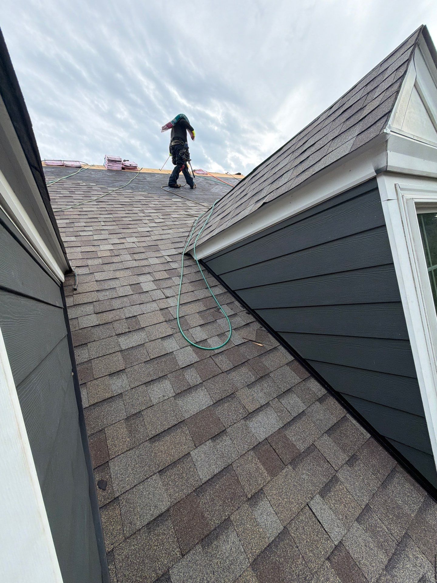 Roof Replacement and White Gutter Installation in Gloucester by Cade Construction