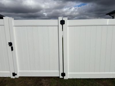 Residential White Vinyl Privacy Fence Installation in Janesville