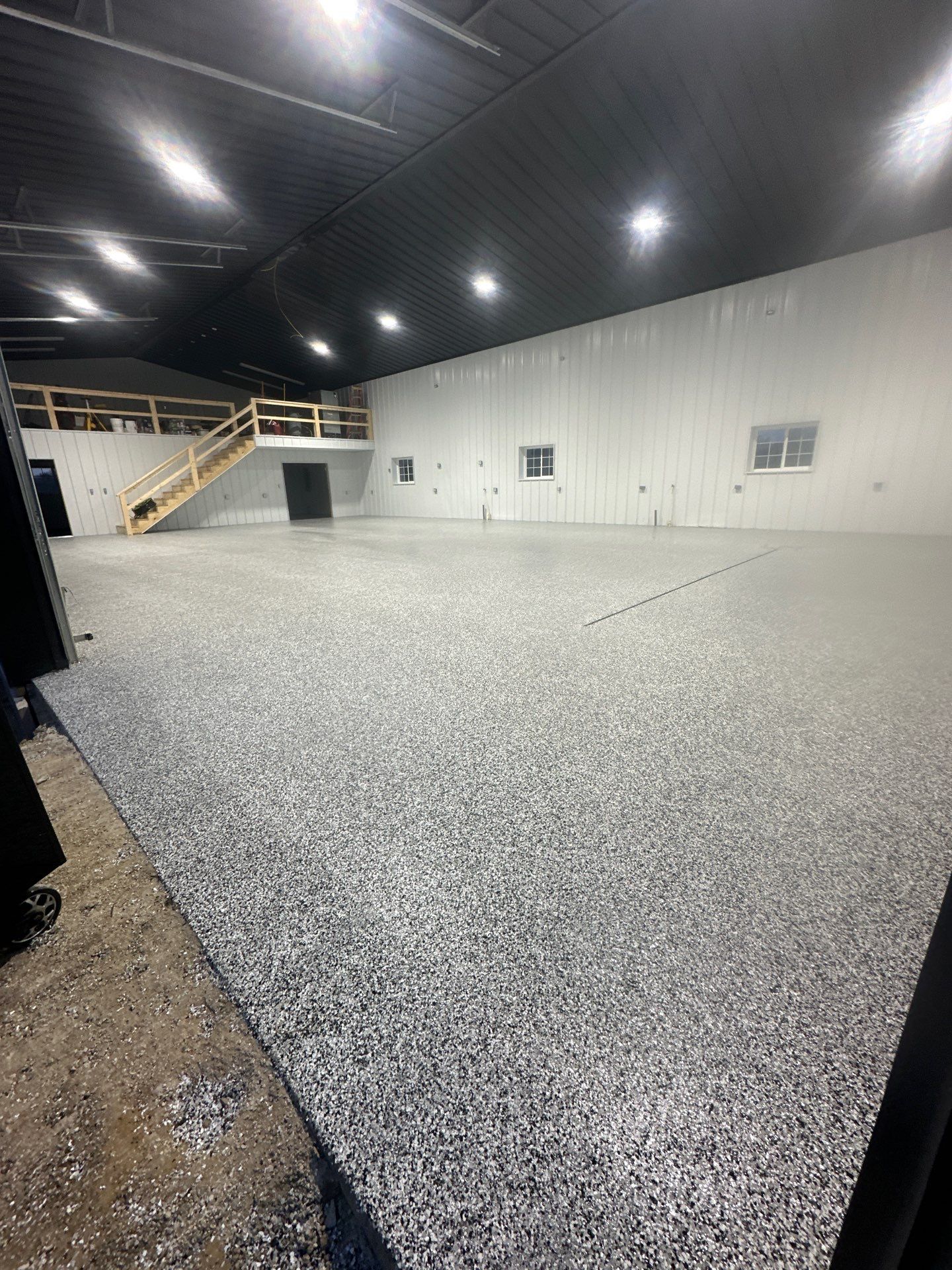 Barndominium Flake Coating using Polyaspartic by Revival Concrete Coatings