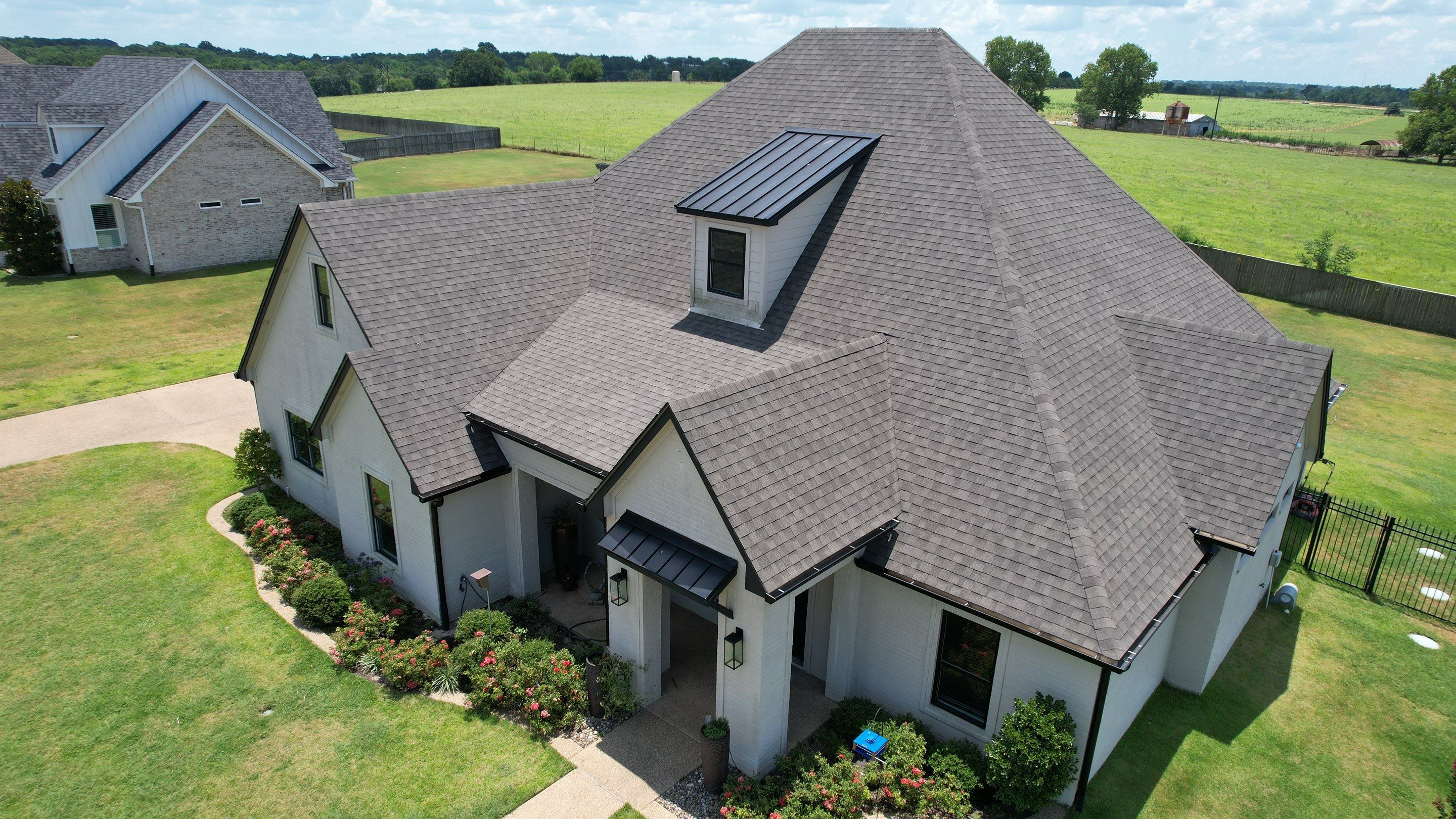 Architectural Shingle and Standing Seam Metal Roof Installation in Mount Selman by Sky High Roofing