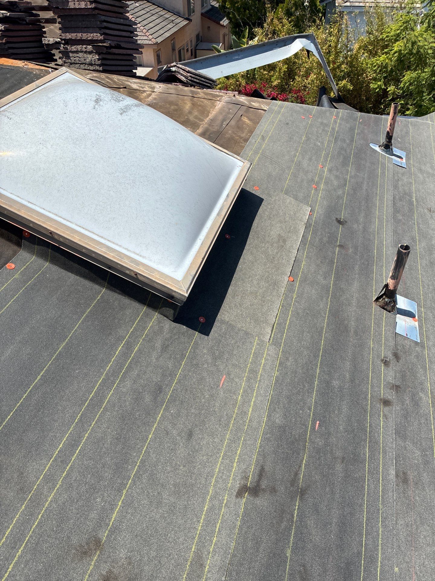 Carlsbad Concrete Tile Roof Replacement with Copper Flashing and Skylights by Reliable Roofing San Diego Inc.