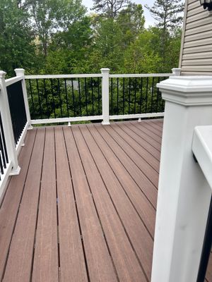 Elevated Composite Deck Replacement with White Railing in Tannersville