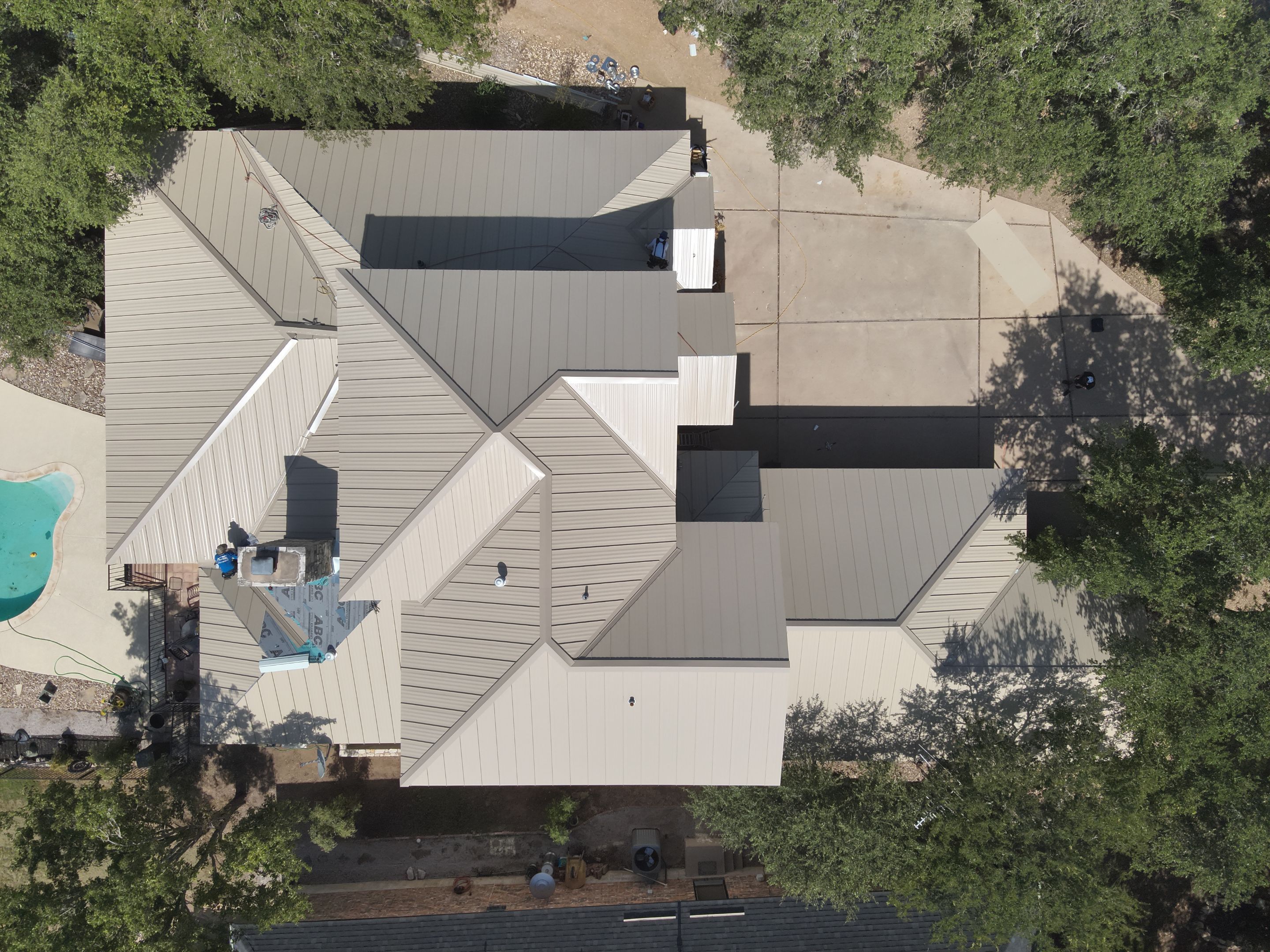 Residential Roof Replacement using 24 GA Double-Lock - Surrey Beige by Action Exteriors Austin