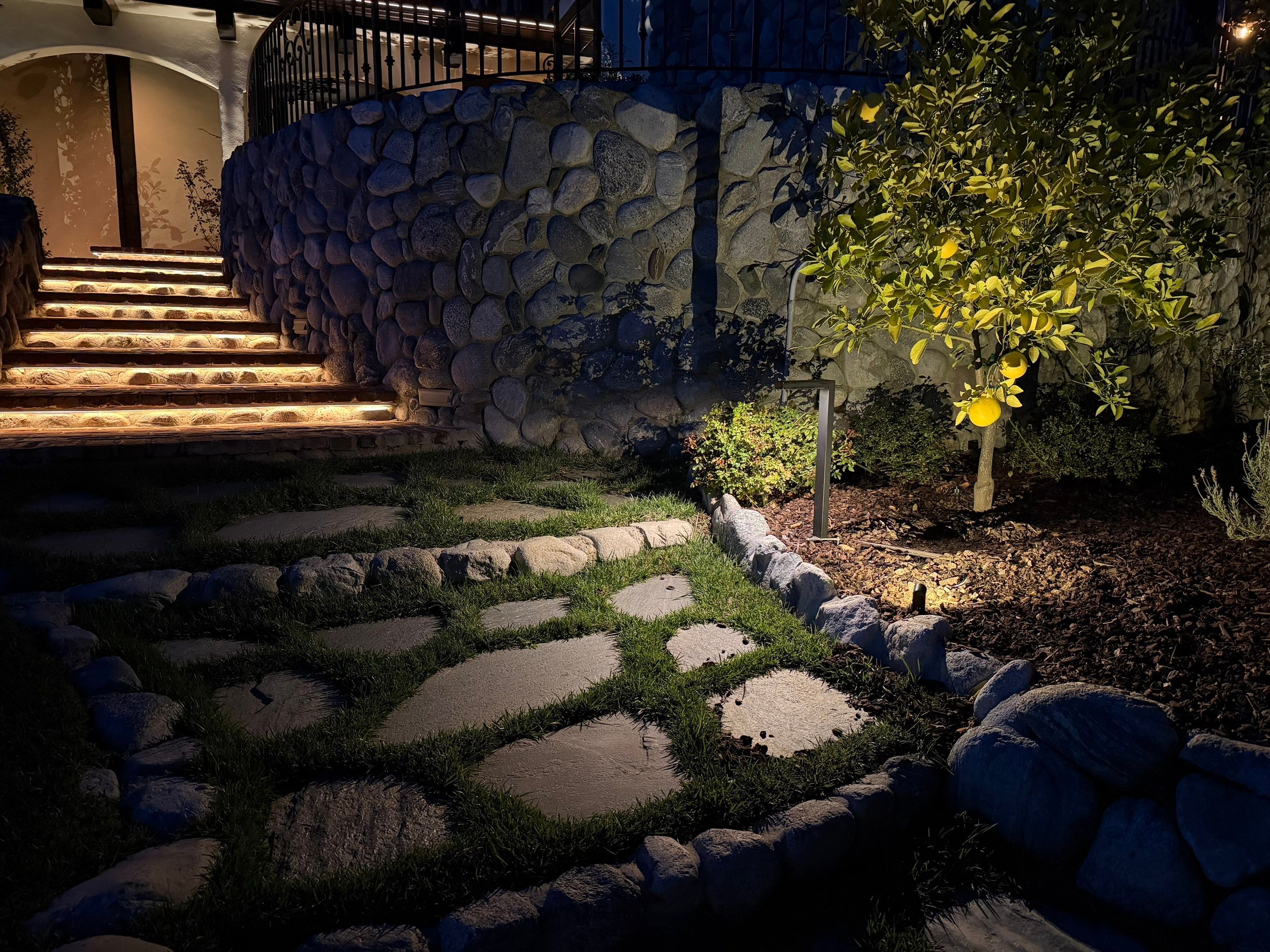 Tudor Estate Landscape Lighting with Integrated Stone Step Illumination by Outdoor Lights + Shades