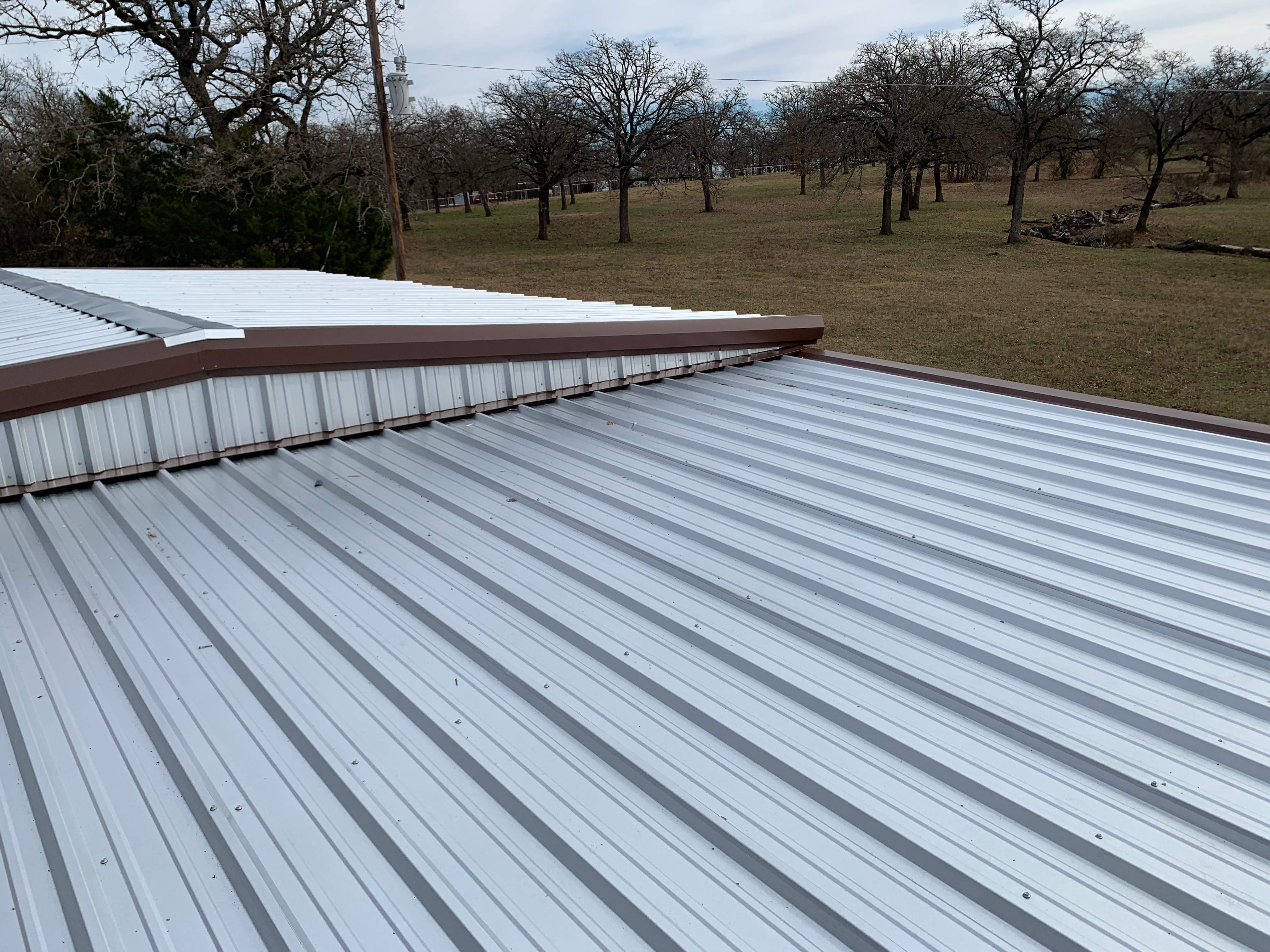 Install new R Panel Metal Roof at a Clients Farm house by First United Roofing & Construction