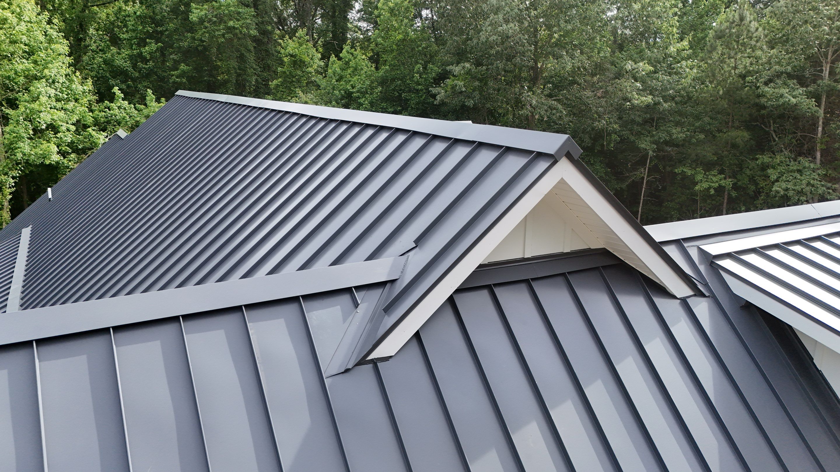 Custom New Construction Home Featuring Standing Seam Metal Roofing in Port Haywood by Cade Construction