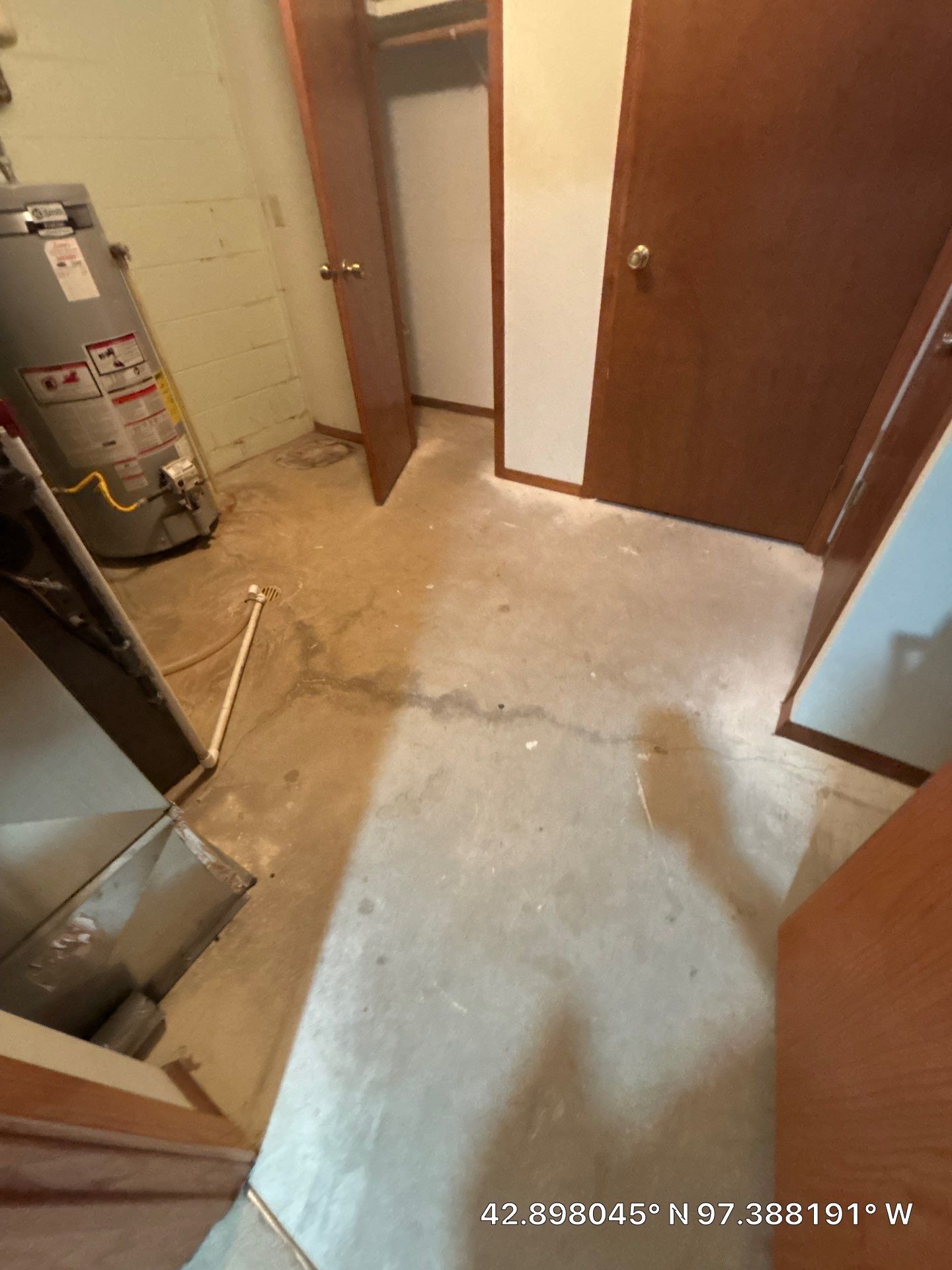 Grey Speckled Concrete Coating for Residential Garage in Yankton by Select Painting, Coatings & Garage Cabinets