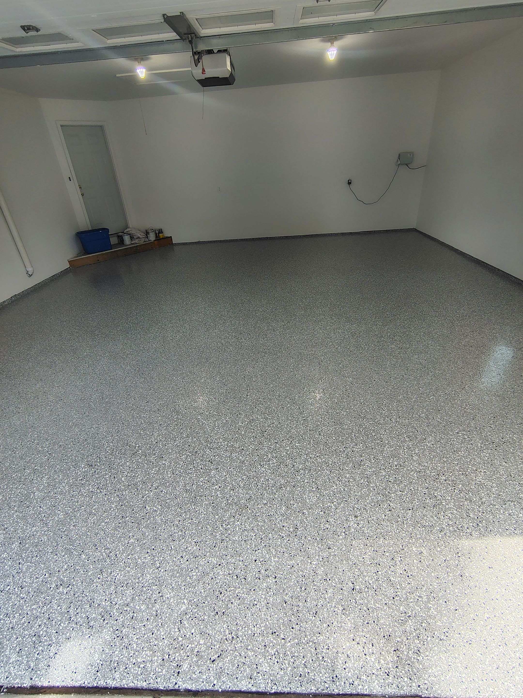 Sioux Falls Garage Floor Coating with Speckled Flake Finish by Select Painting, Coatings & Garage Cabinets
