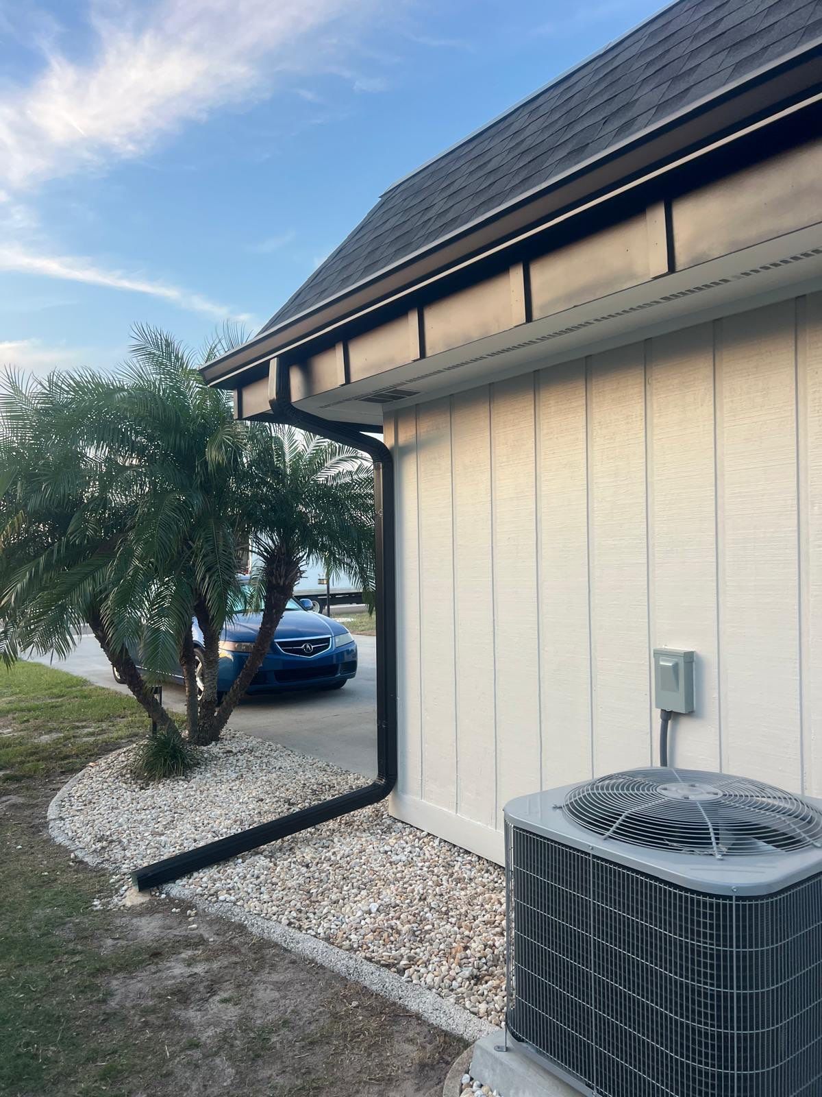 Black 6'' Seamless Gutters K-Style and Black Downspouts in Sun City Center FL by Gutter Professors