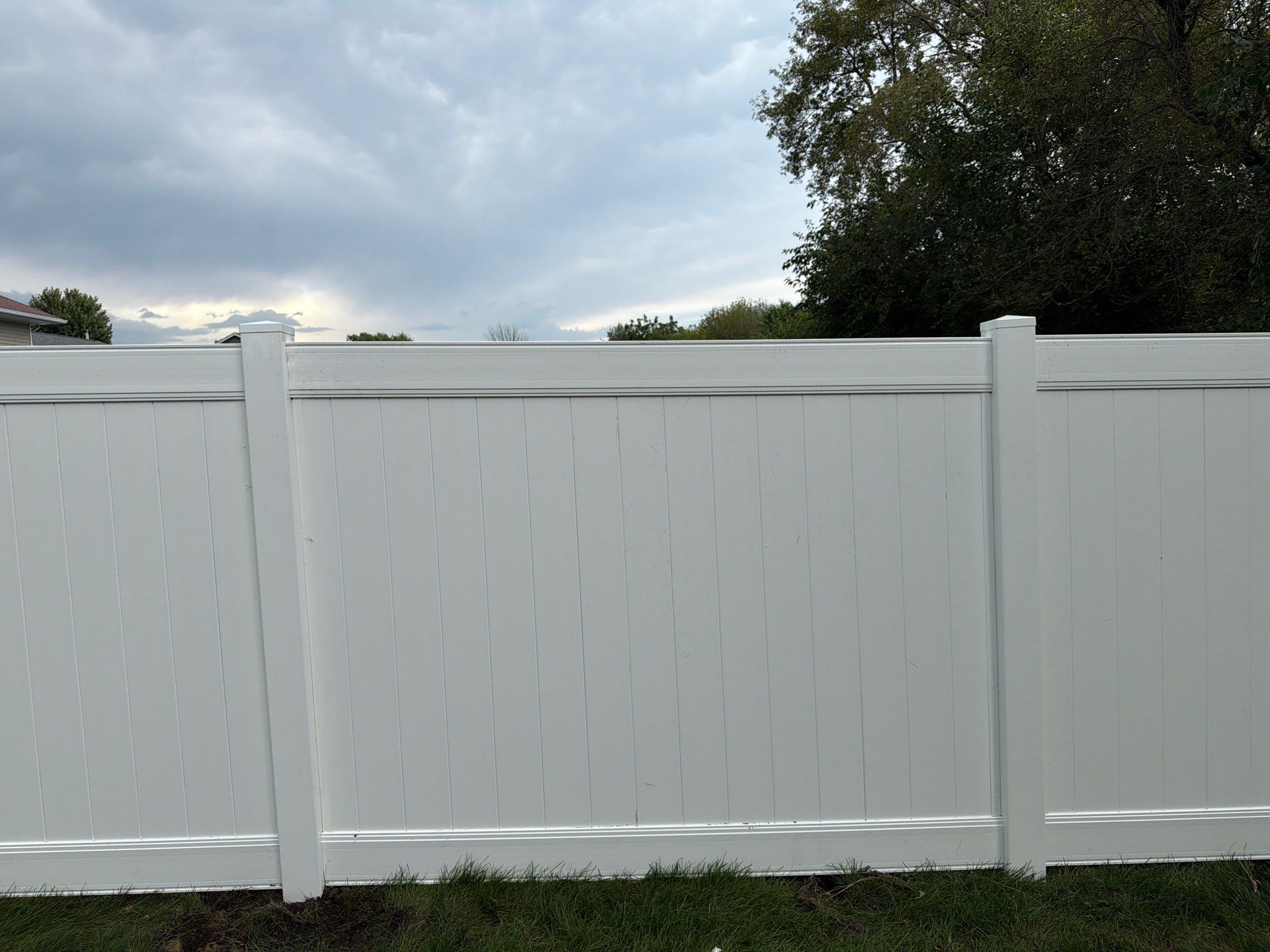 White Vinyl Privacy Fence Installation in Raymond, IA by Perfect Picket Fence and Stain
