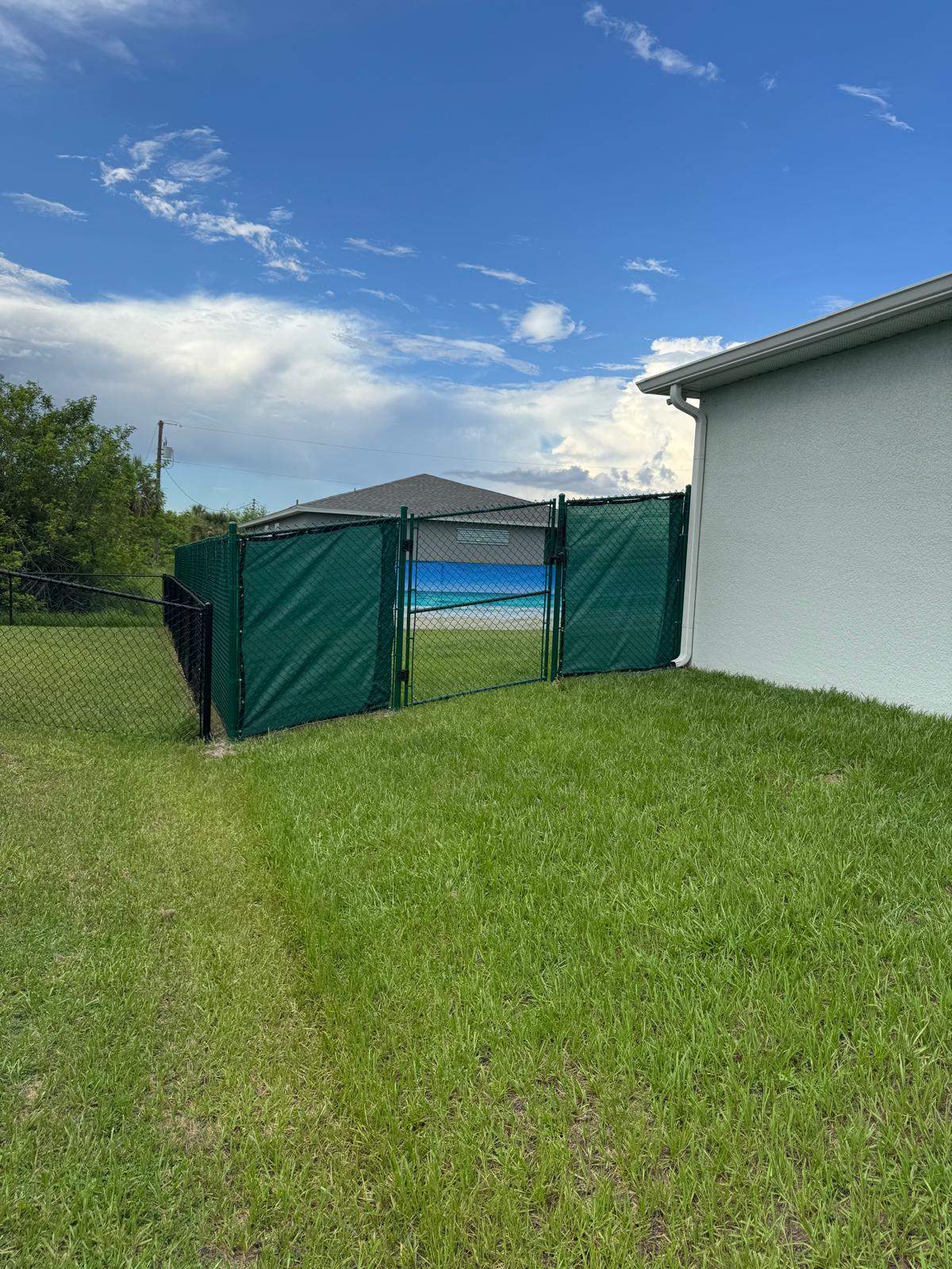 Chain Link Fence Installation with Custom Beach Privacy Screen in Port Charlotte by True Fence LLC