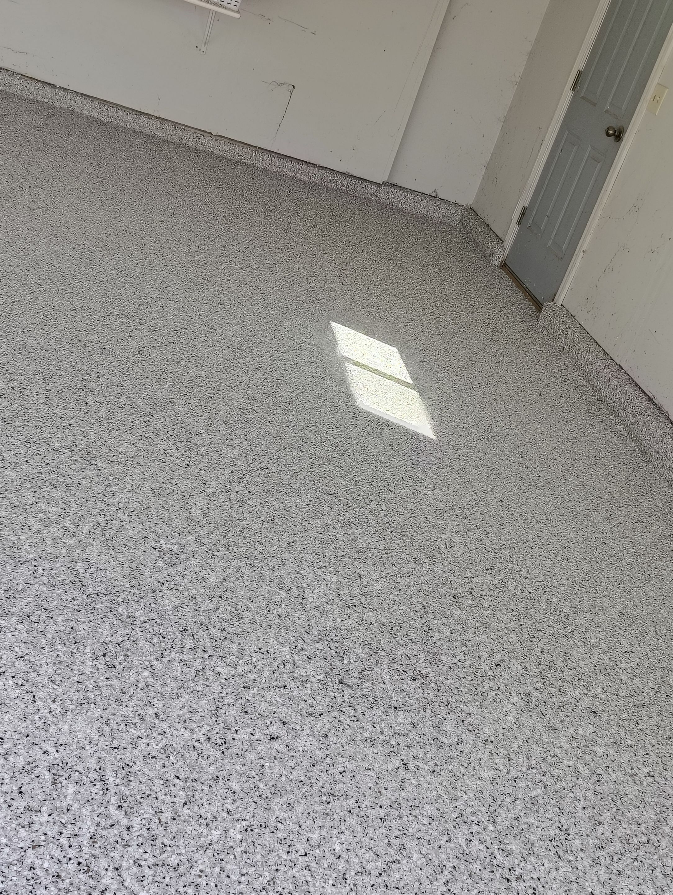Decorative Chip Epoxy Garage Floor Coating in Sioux Falls by Select Painting, Coatings & Garage Cabinets