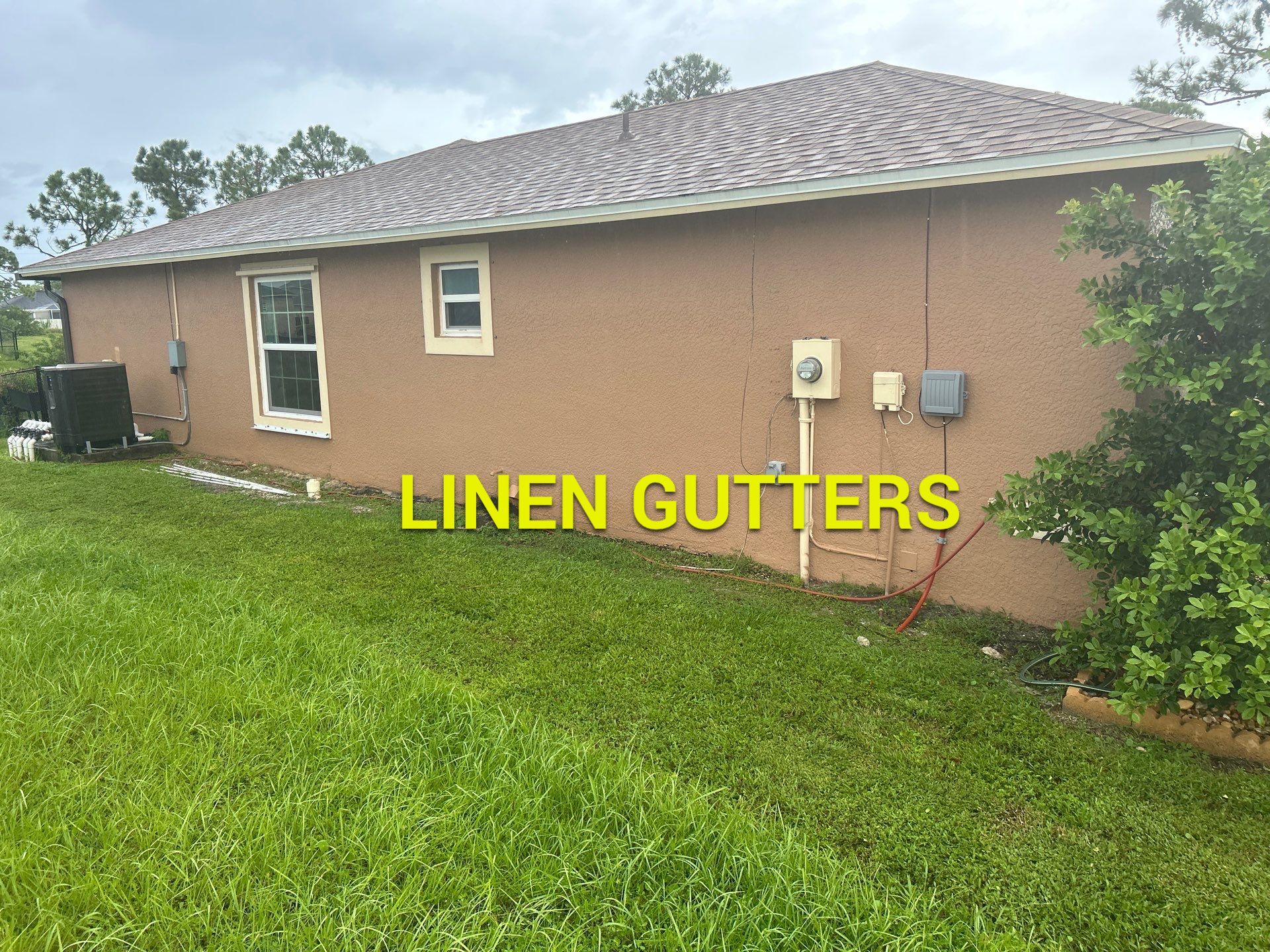 Linen seamless gutters and downspouts installation in Sarasota, FL by Gutter Professors