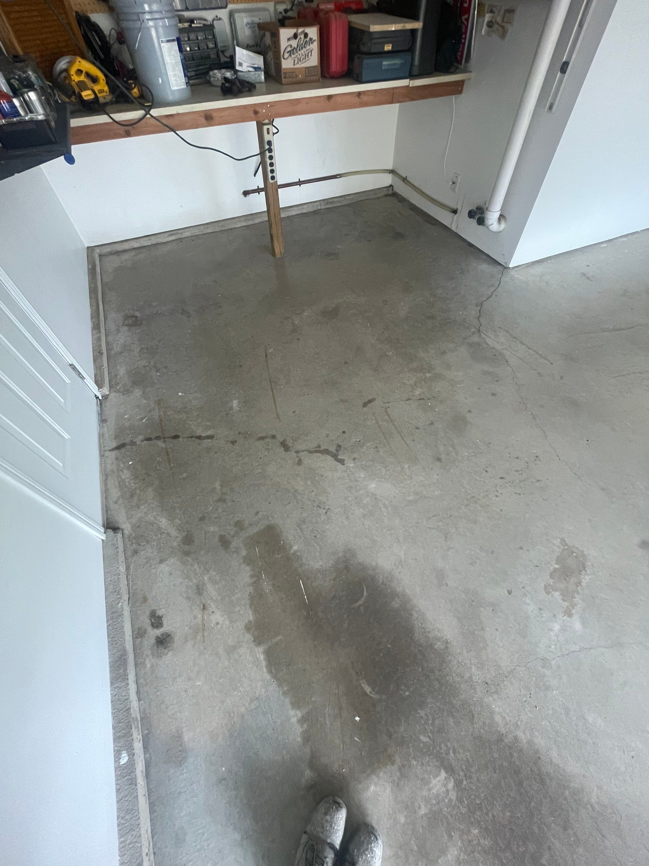 Feather Grey Garage Floor Coating Installation in Sioux Falls by Select Painting, Coatings & Garage Cabinets