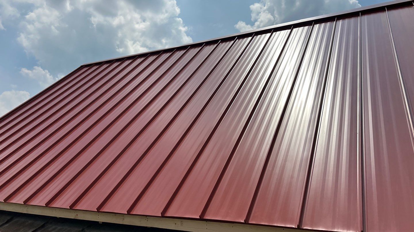 Residential Roofing Installation using Standing Seam Metal - Barn Red by RoofX 