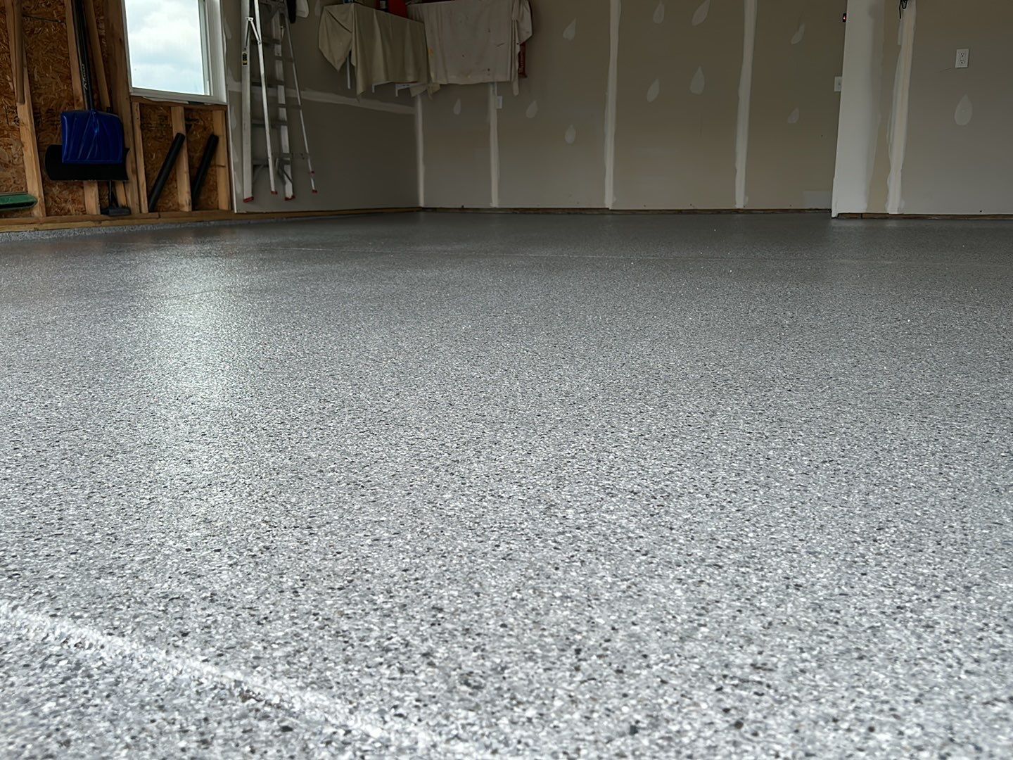 Silverado garage floor coating  by NG Masonry & Construction LLC