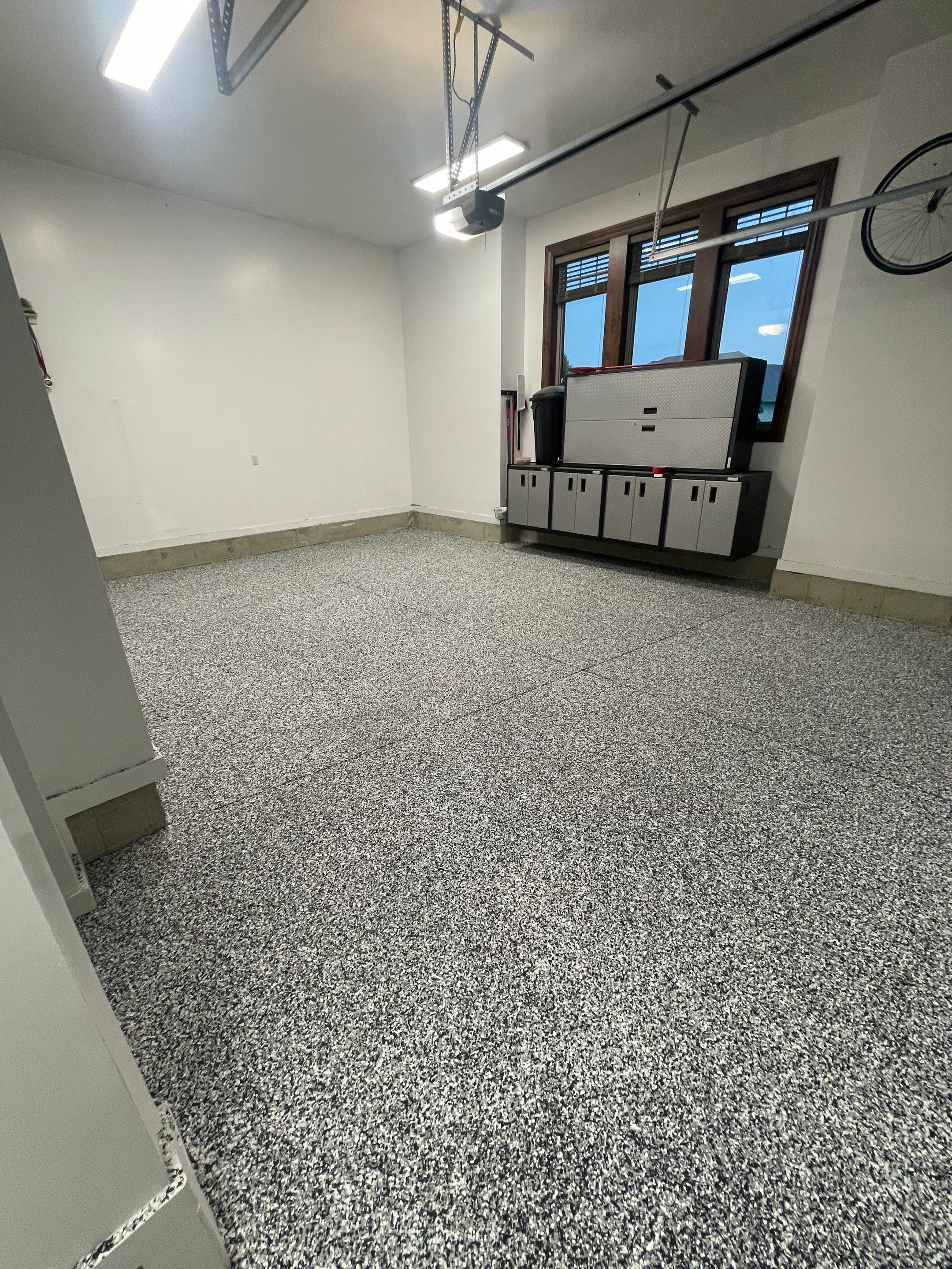 Garage Floor Coating and Domino Flake Finish in Sioux Falls by Select Painting, Coatings & Garage Cabinets