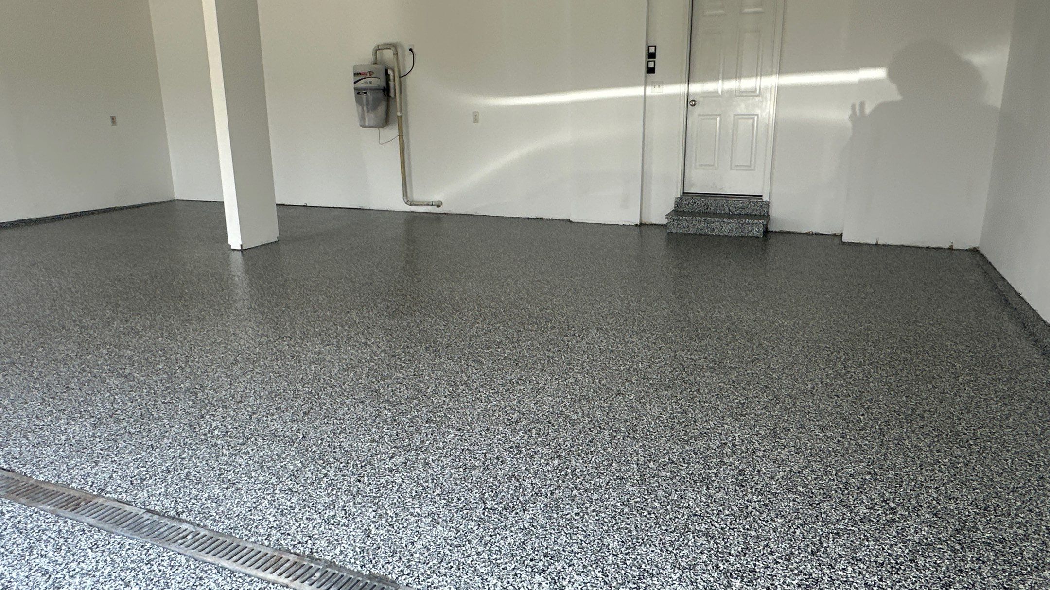 Laura B. garage transformation with a new floor and garage storage  by Banner Garage