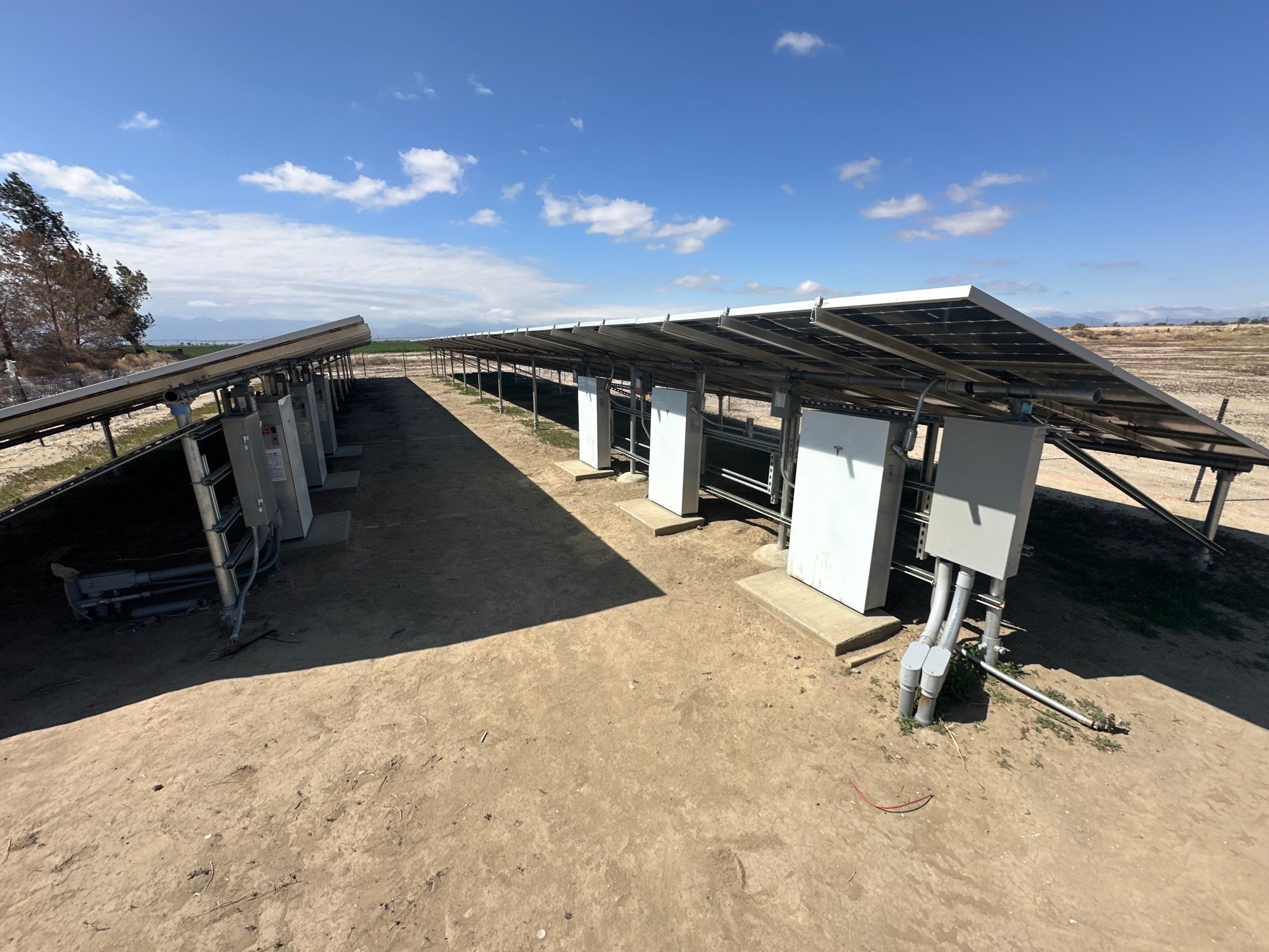Large-Scale Ground-Mount Solar and Tesla Powerwall Battery Installation by AWS Solar