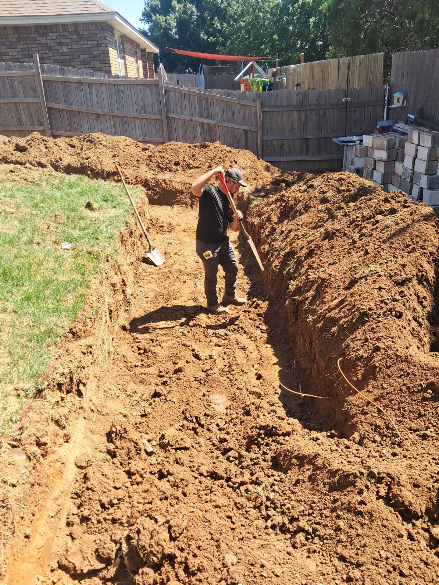 Custom Segmental Block Retaining Wall and Sod Installation in Lawton by Clays Services Inc