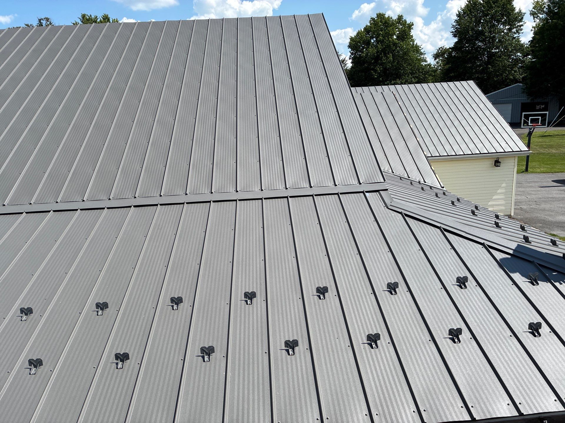 Newport Metal Roof Replacement with New Skylights by Esh Builders