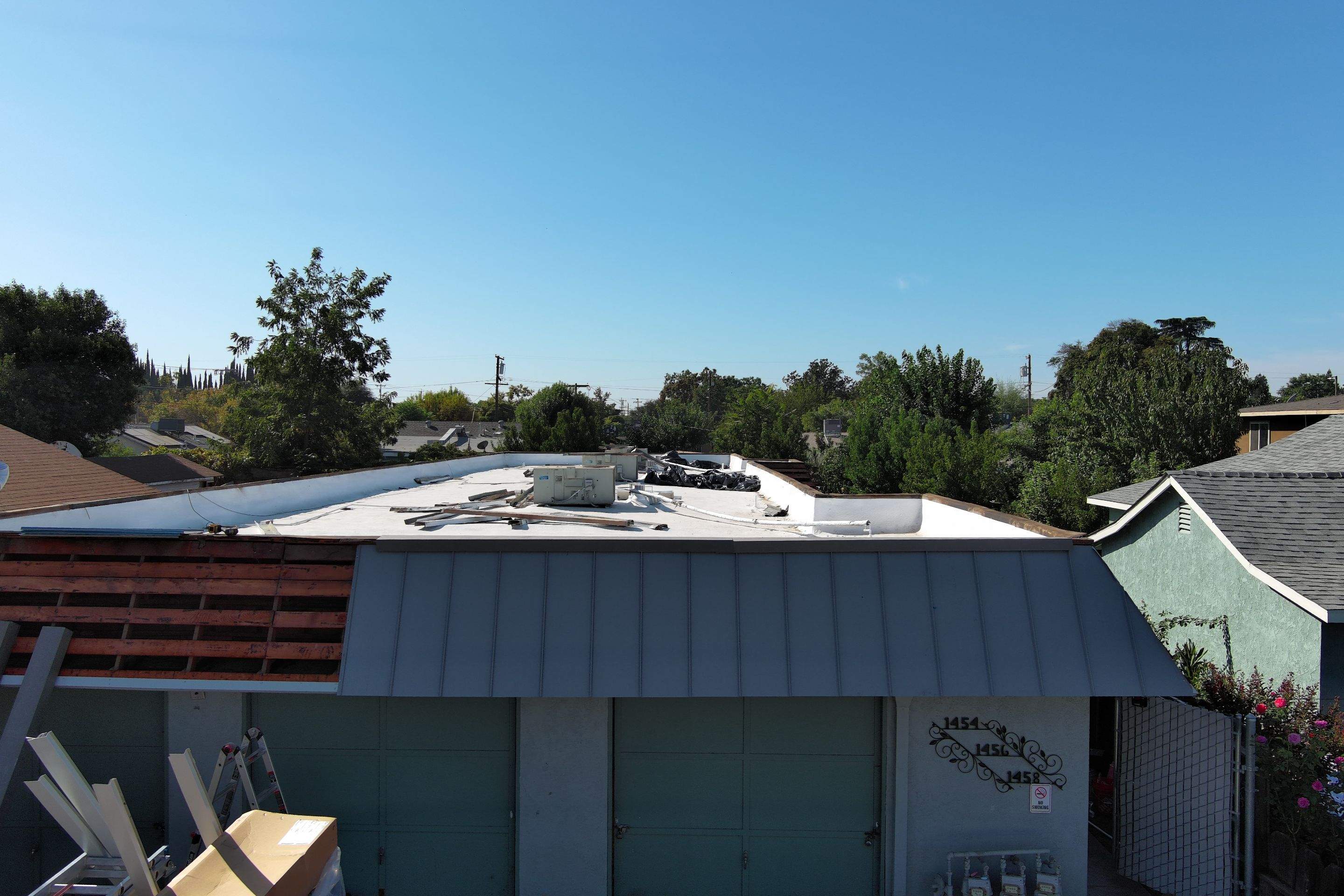 Foam Refurbish using Conklin Benchmark/PUMA XL coatings and spray foam; Also metal roofing around parapet wall by Straight Edge Roofing Inc