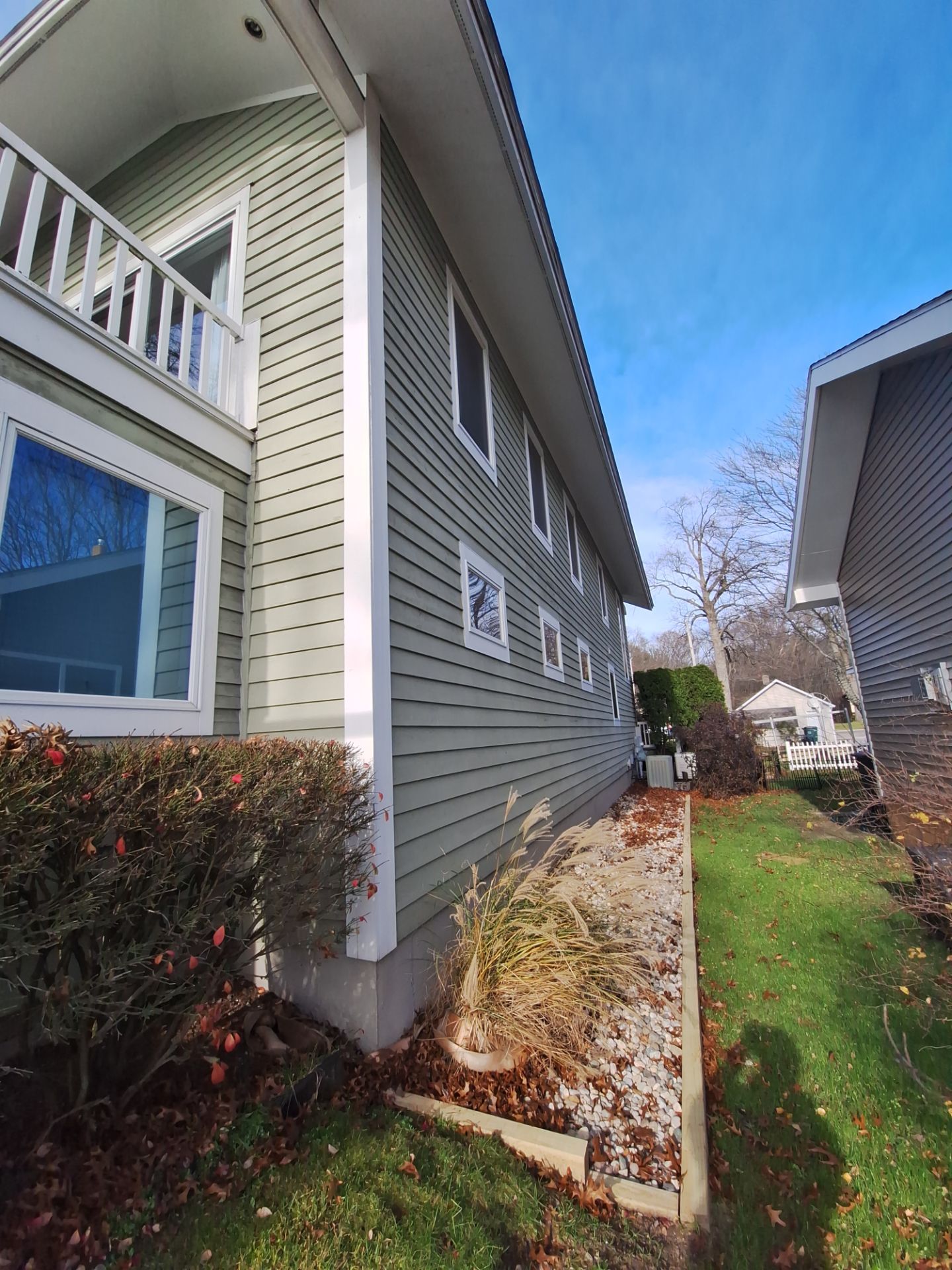 Full Exterior Painting and Trim Restoration for Muskegon Residence by Gordon Painting